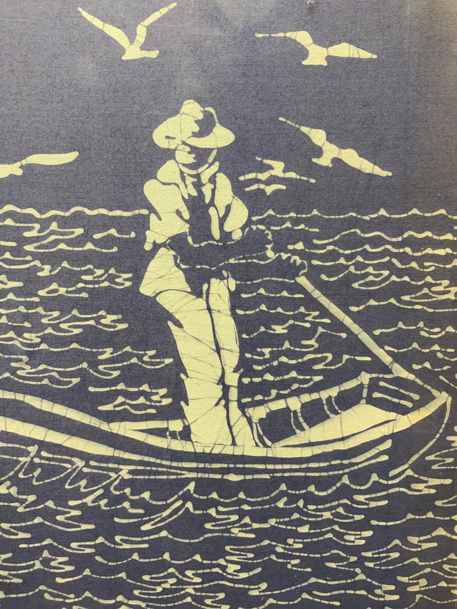 Fisherman Coming to Shore Stretched Fabric Print: Inscription in bottom right corner. Inscription is illegible. Signed in print. Subject depicts a fisherman or boatman steering a small boat into shore. Stretched onto internal frame. Internal frame me