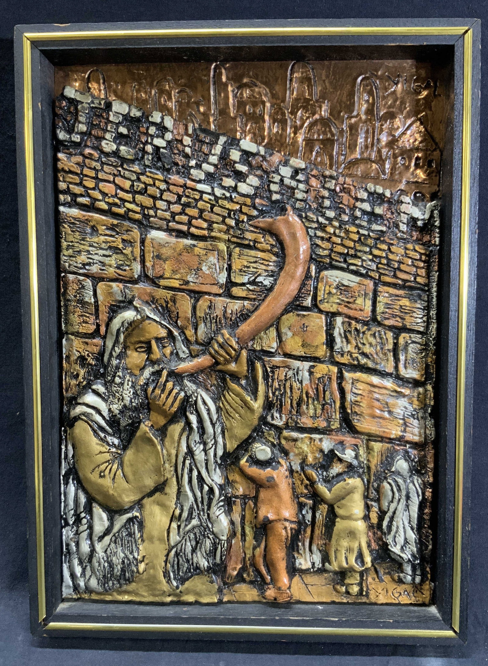Yigal Yom Kippur Western Wall High Relief: Plaster or resin on copper repousse. Signed on top and bottom right corners. Subject depicts a man blowing a horn near the western wall where Jews pray for forgiveness for their sins on Yom Kippur. Fr