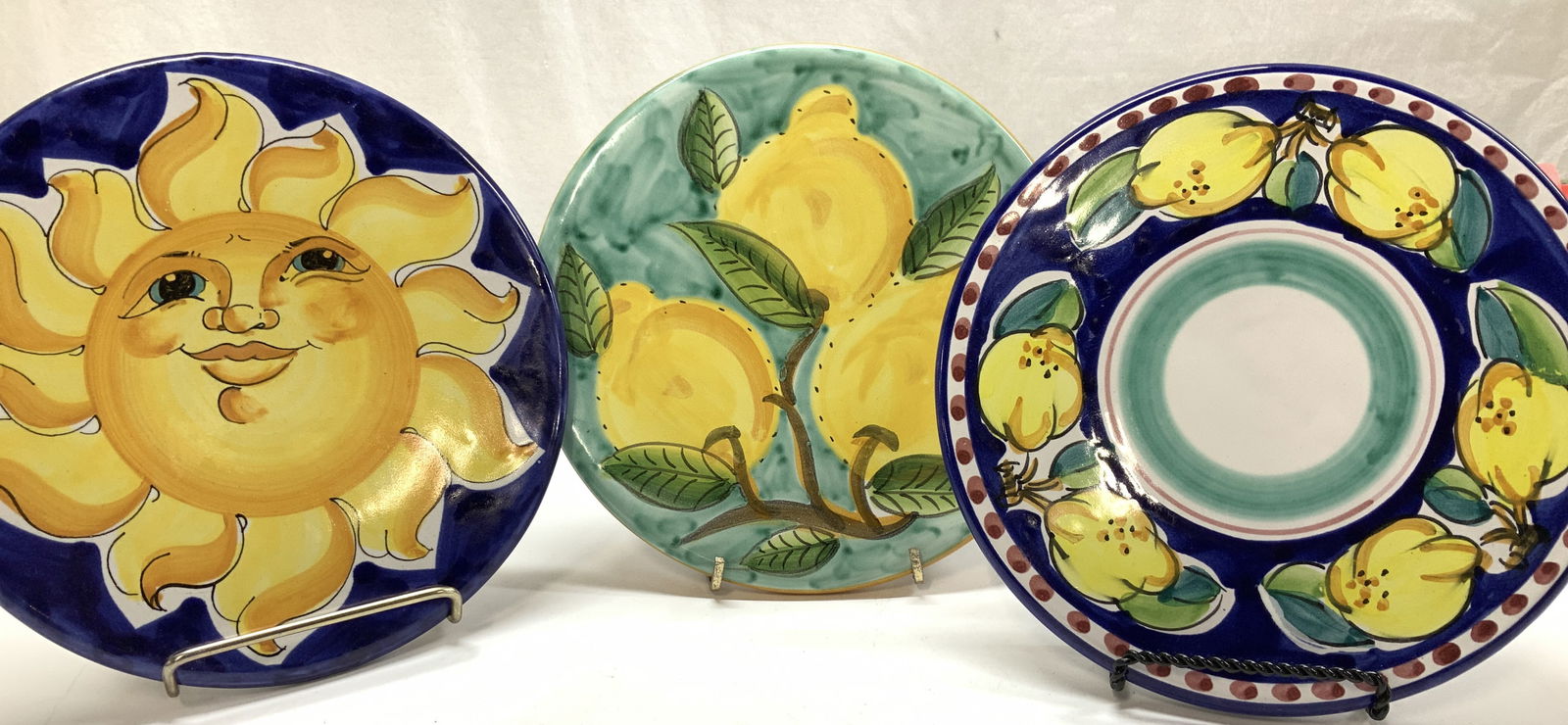 Set3 Italian Pottery, P Sorrentino & More: Handmade and hand painted trivets and wall plate. Festive Italian Amalfi Coast lemons and sun decor. Two are stamped P. Sorrentino Ravello. Food can touch the surface. One of these can be hung on the