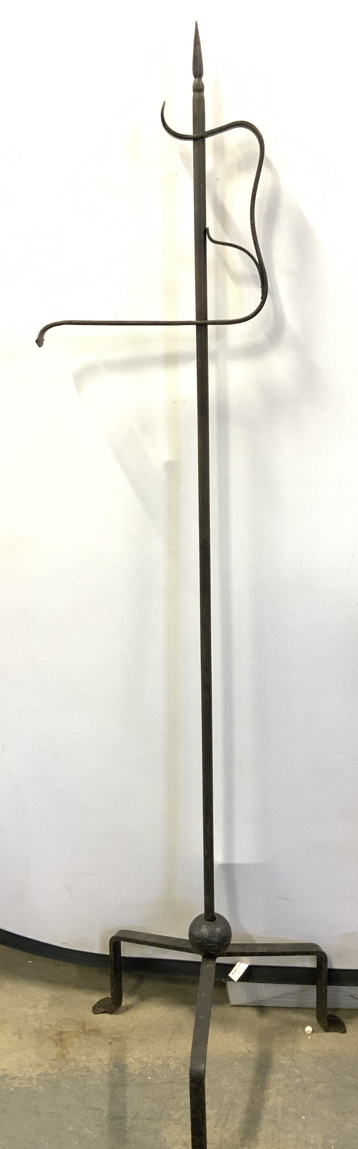 Iron Hanging Plant Stand, 54 in. Tall: 3 footed iron hanging flower basket stand, 54 in. Tall. Up cycle for hanging signs or other needs. Center bar has a 360 degree swivel and measures 10.75 in. Wide. Base measures 15 in. Wide. Home and g