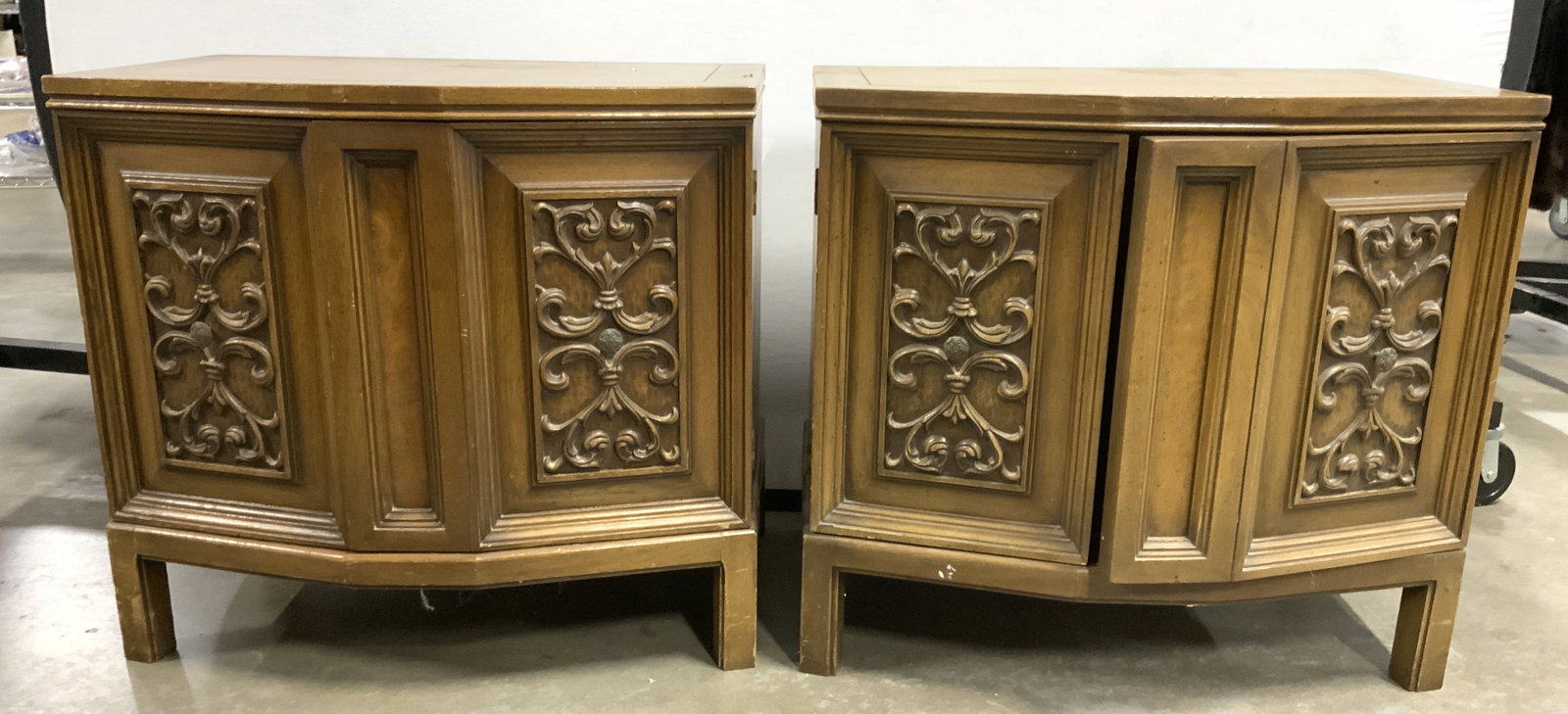 ROMWEBER Pr Vintage Carved Wooden Nightstands: Tag on interior reads ROMWEBER. Lot includes 2 nightstands. Each are tan toned and wooden. Nightstands each have carved wooden scroll detail to cabinet doors. Interiors each have 2 drawer. Each measur