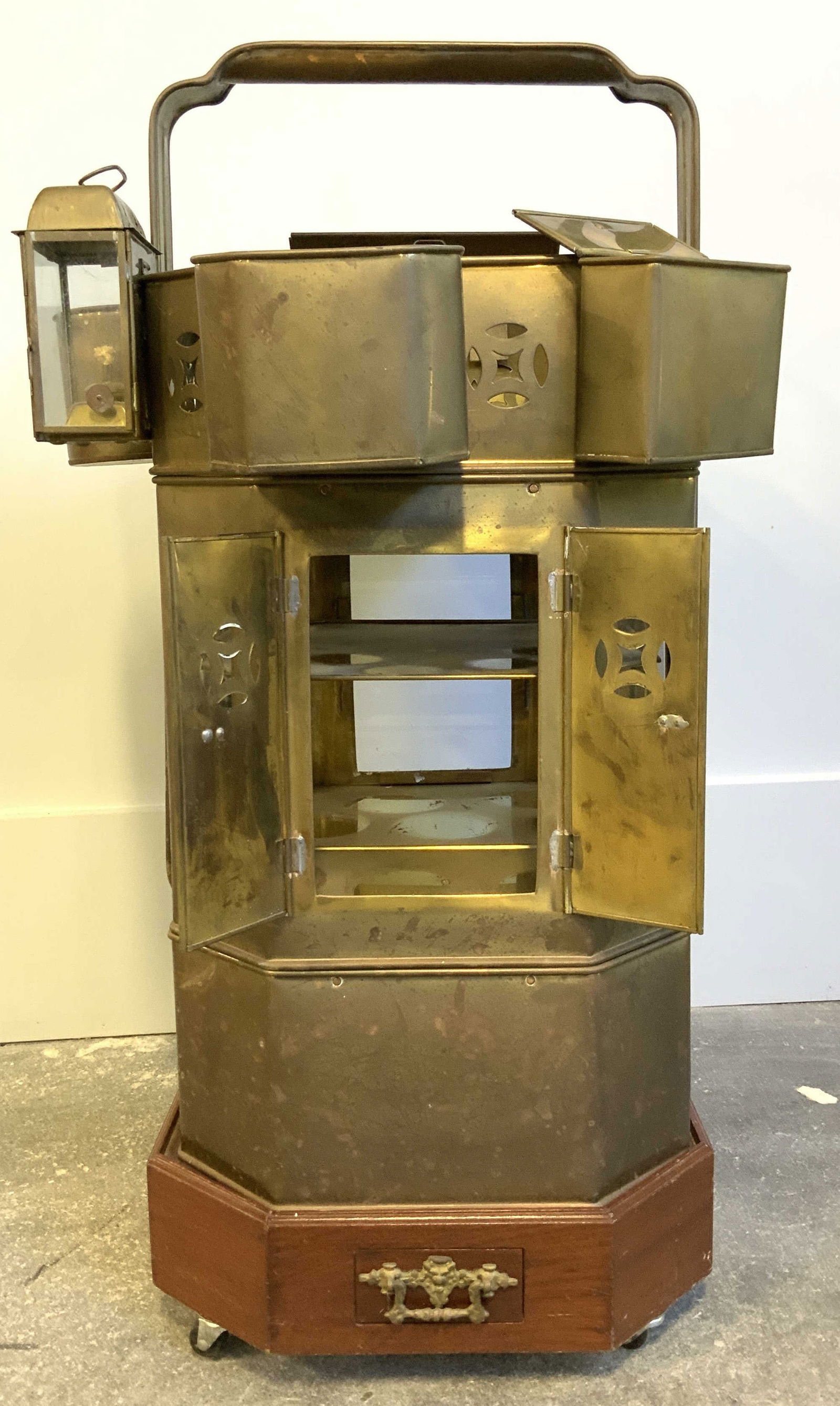 Asian Brass Street Vender Cart on Caster Base 28in: 28.5 in. Tall. Asian Street Vendor cart with multiple hanging lidded boxes for food storage. Sits on a wooden base with castor wheels ( 1 wheel missing from hardware) base measures 5 in. Ht. , 14.5 in