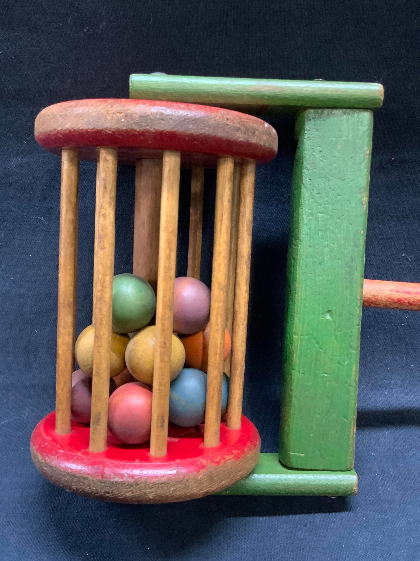 Vintage Handmade Klickity Klacker Push Toy: A vintage handmade Klickity Klacker push toy. Balls to the interior of base. Crafted from wood and painted. Measures approx. 24.75L x 7W in. Some surface wear, losses to paint, and chipping present. H