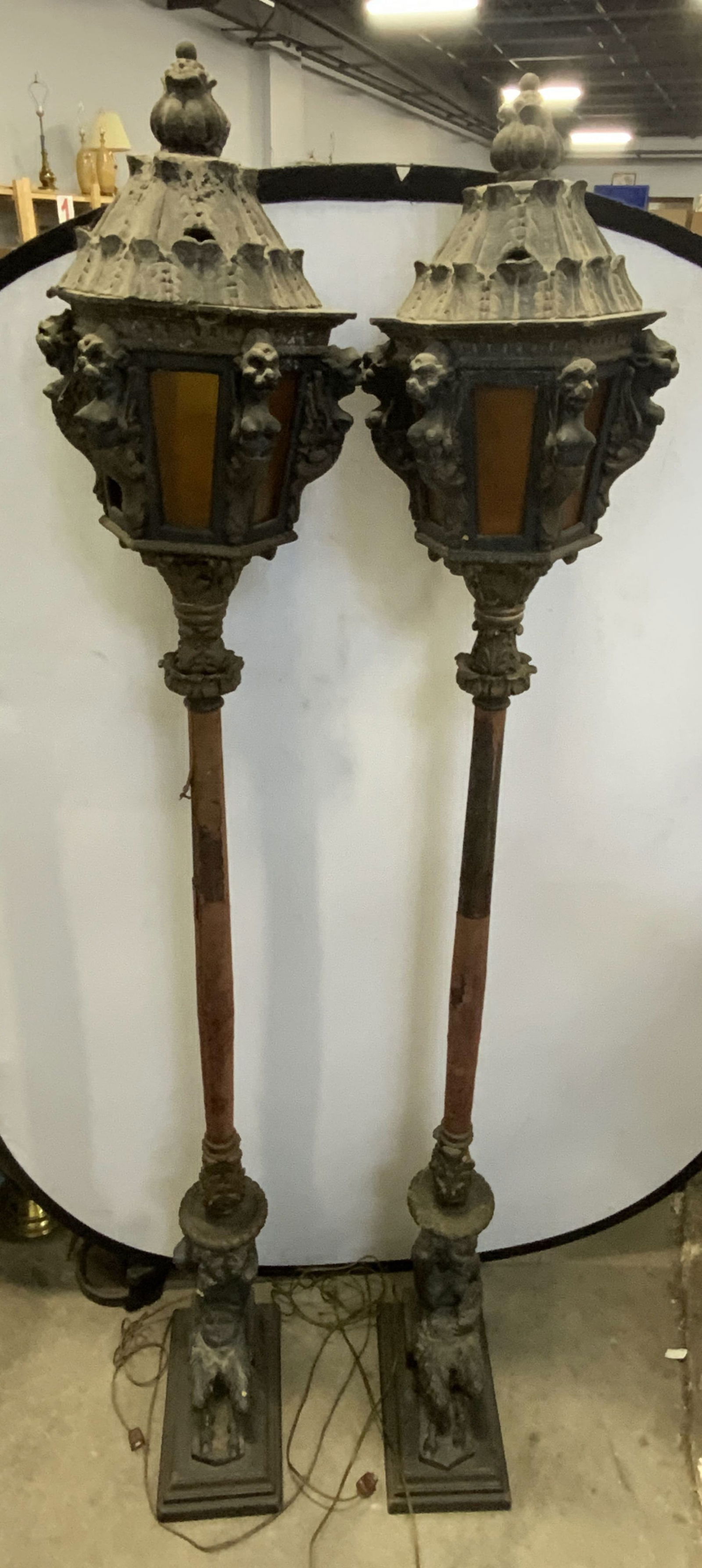 Pr Vntg Satyr & Chimera Figural Floor Lamps 80in: A pair of vintage floor lamps crafted from wood and gesso, possibly plaster material and pressed wood. The tops feature amber glass panels surrounding a single light. Nude chimera figures between each