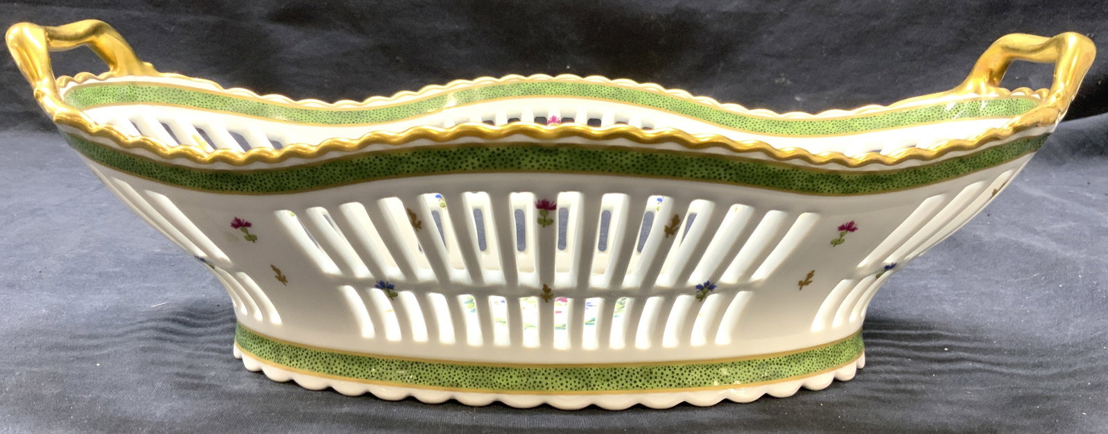 HAVILAND LIMOGES Porcelain Basket Paris 13in: Underside is marked HAVILAND LIMOGES VIEUX PARIS. Basket is porcelain. Piece has gilt rim and handles. Piece has multi toned floral and leaf detail. Basket has pierced detail. Piece measures approxima