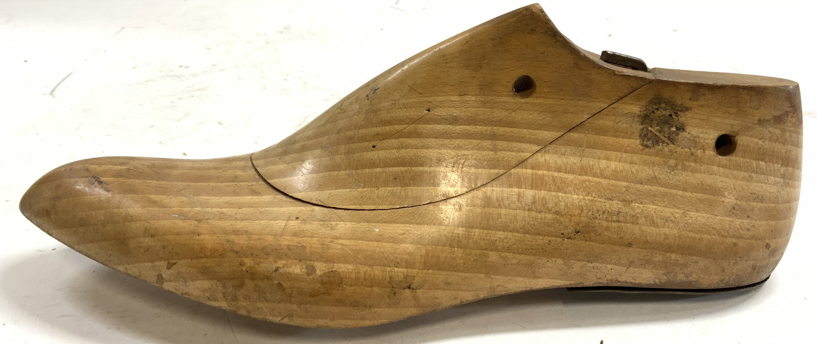 Vintage Carved Wooden Shoe Tree: Shoe tree is vintage & wooden. Piece is tan toned. Heel area is metal. Shoe tree measures approximately 11 inches long 4 inches tall 3.5 inches wide. Shoe tree, vintage shoe tree, vintage shoe mold, s