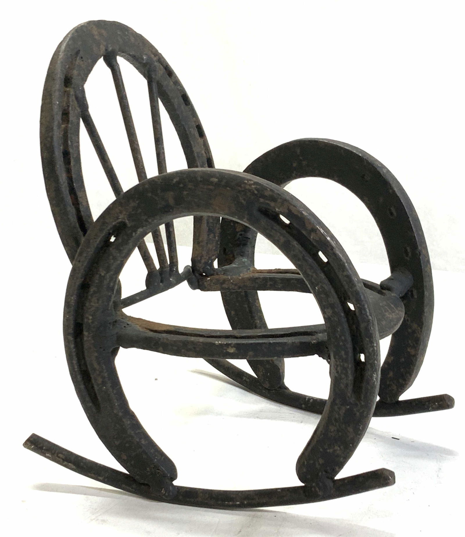 Iron Horseshoe Folk Art Doll Sz Rocking Chair: Up cycled iron horseshoes made into a doll size rocking chair. Measures 7.25 in. Tall x 6 in. Deep x 5 in. Wide, hand crafted. Light rust to iron. Artisanal Ironware, up cycled Equine Iron Horseshoes,