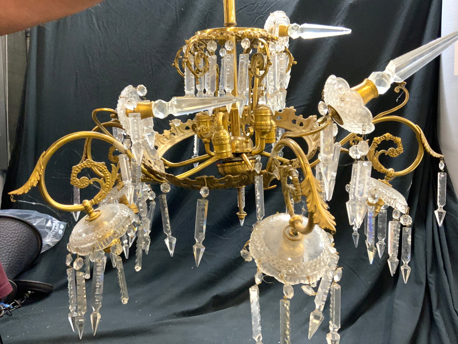 Vntg Gilt Metal Art Nouveau Ornate 5 Arm Chandelier: Chandelier is vintage. Piece is has ornate art nouveau style. Chandelier has numerous glass ornaments. Piece has acanthus leaf scroll detail. Chandelier is gilt metal, possibly brass. Measures approx 