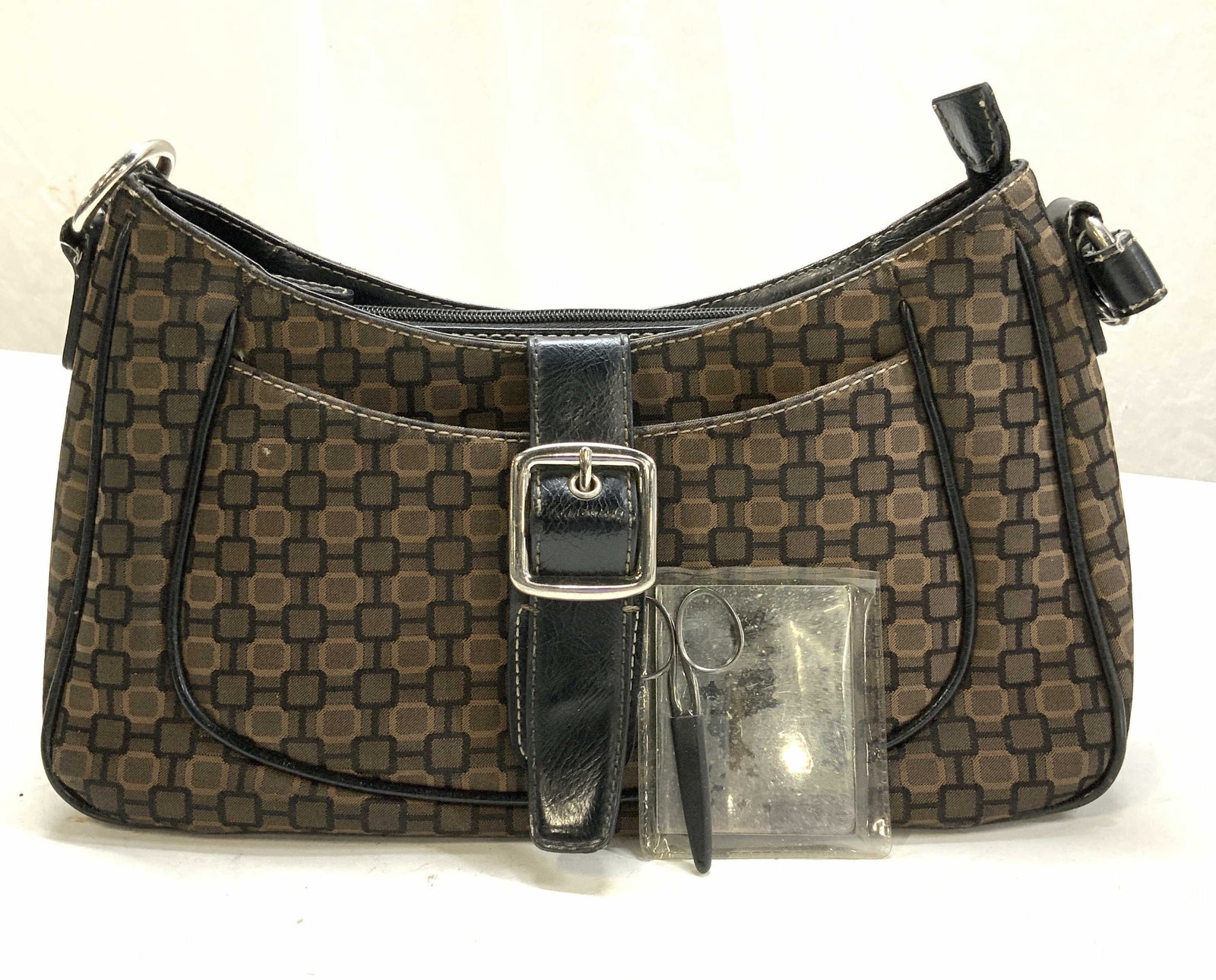 Nine West Pocketbook w Pocket Mirror & Scissors: Nine West vintage pocketbook with pocket mirror and nail scissors. Geometric print. Interior wear. Zipper closure. Exterior pocket and interior pockets. Faux leather trim . Some exterior wear. Measure