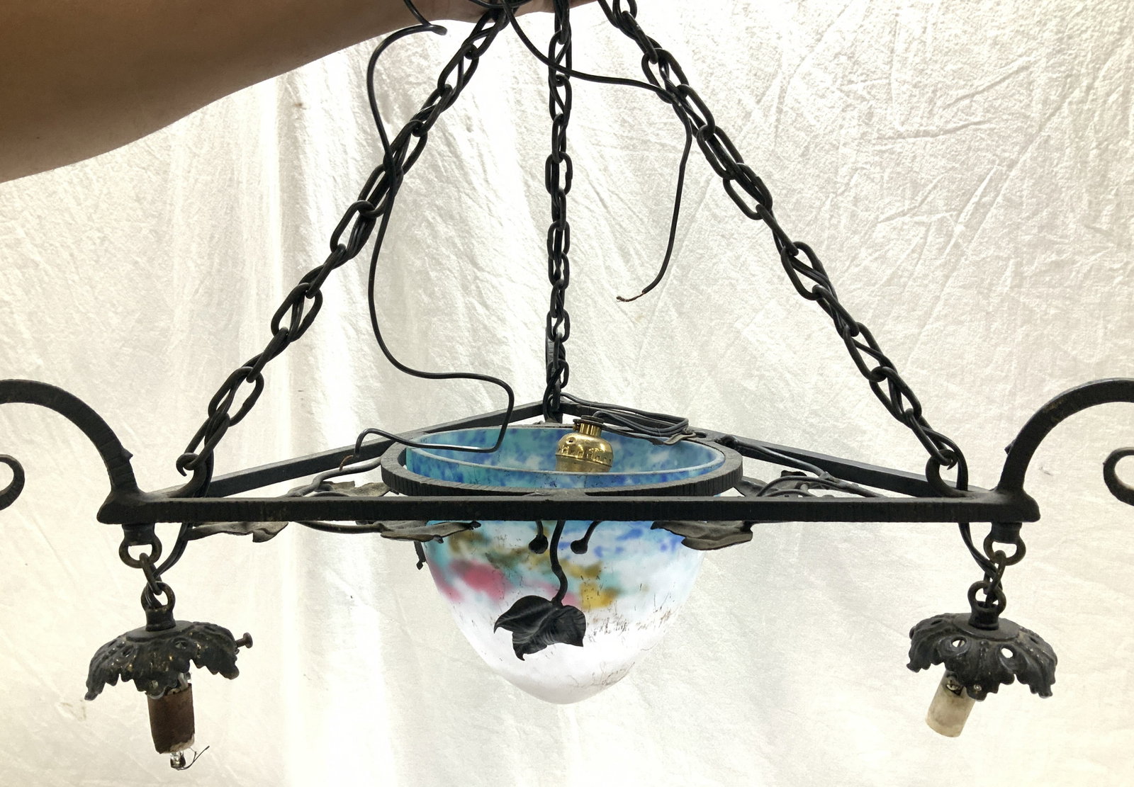 Cast Iron Art Nouveau Chandelier w Art Glass Shade: Triangular cast iron and metal black chandelier with center light and three additional lights at each triangle tip. Grape vine leaf motif . Three chains come together to hold up the light with an embo