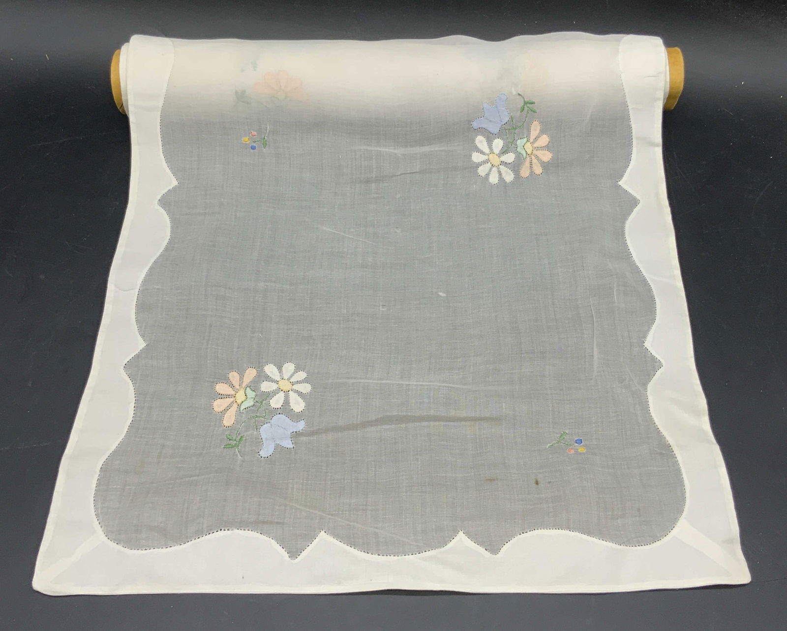 Vintage Floral Embroidered Fabric Roll: Vintage soft hand off white hued floral embroidered fabric. Semi sheer and opaque fabric. Multicolored florals. The fabric is rolled onto a cardboard dowel. Fabric has not been unrolled. Roll measures
