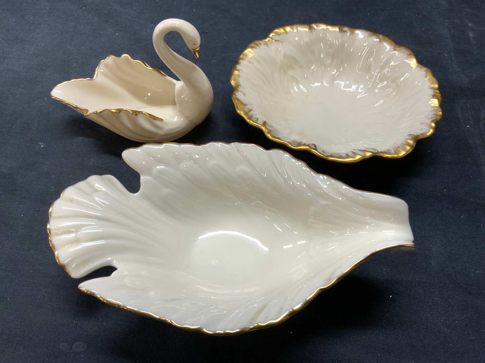 LENOX Lot 3 Gilt Rim Porcelain Dishes Lenox USA +: Underside of each piece are marked LENOX MADE IN USA. Lot includes 1 swan form vessel, 1 dove form vessel, & 1 floral form vessel. Each piece has gilt rim. Largest piece measures approximately 8 inche