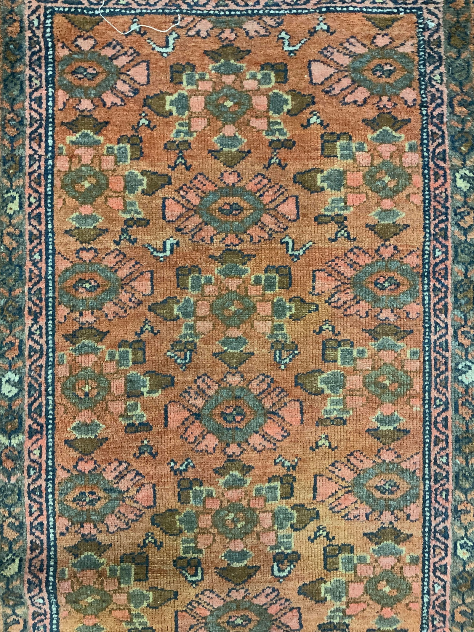 Vintage Handmade Persian Wool Area Rug: Rug is handmade and wool. Piece is vintage. Rug has intricate multi toned floral, leaf & geometric detail. Piece appears to be Persian. Rug measures approximately 46 inches long 30 inches wide. Rug, c
