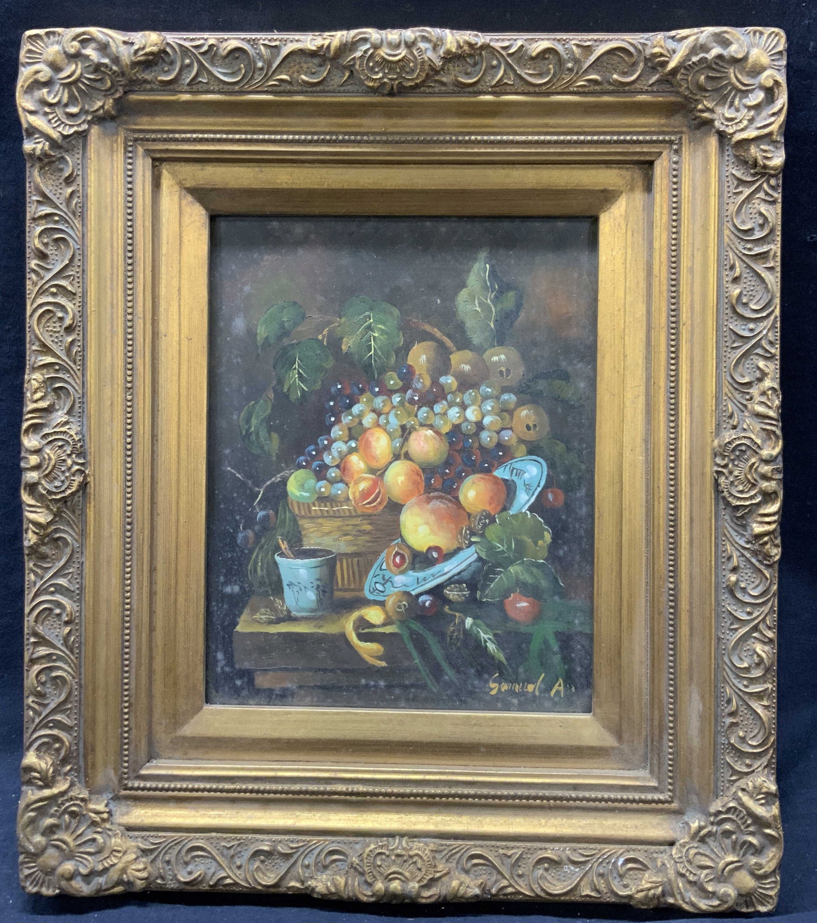 Framed & Signed Still Life Fruit Bowl Oil Painting: Oil paint on wood panel. Signed on lower right corner. Signature illegible. Subject depicts a still life of a fruit bowl with blue dishes and foliage. Framed in gilt ornate wooden frames with scrollin