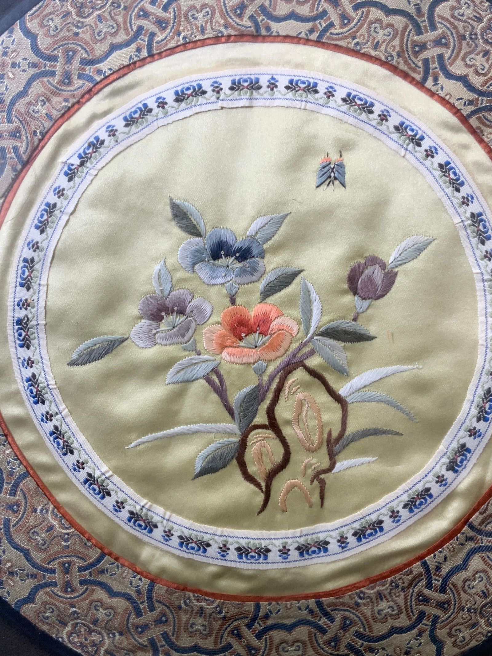 Framed Vintage Chinese Silk Embroidered Panel: Silk embroidery. Subject depicts Asian flowers with butterfly. Silk embroidered patterned border. Framed in gilt wood frame. 12.75 W x 12.75 H in. Not viewed outside of frame. Minor wear to frame. Asi