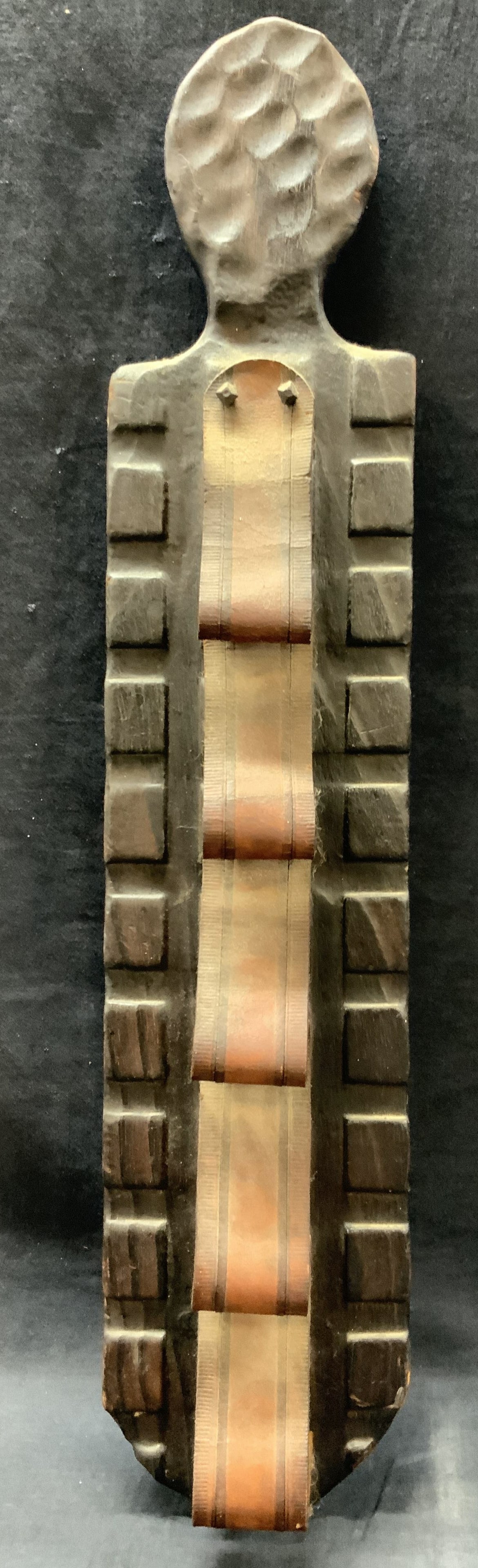 Handcrafted Wooden Leather Wall Art: Handcrafted wooden board. Leather affixed in loops. Possibly for storage. Measures approx. 28 W x 6 H in. Indentations on verso for hanging purposes. Minor wear to wooden and leather. Wall art, home d