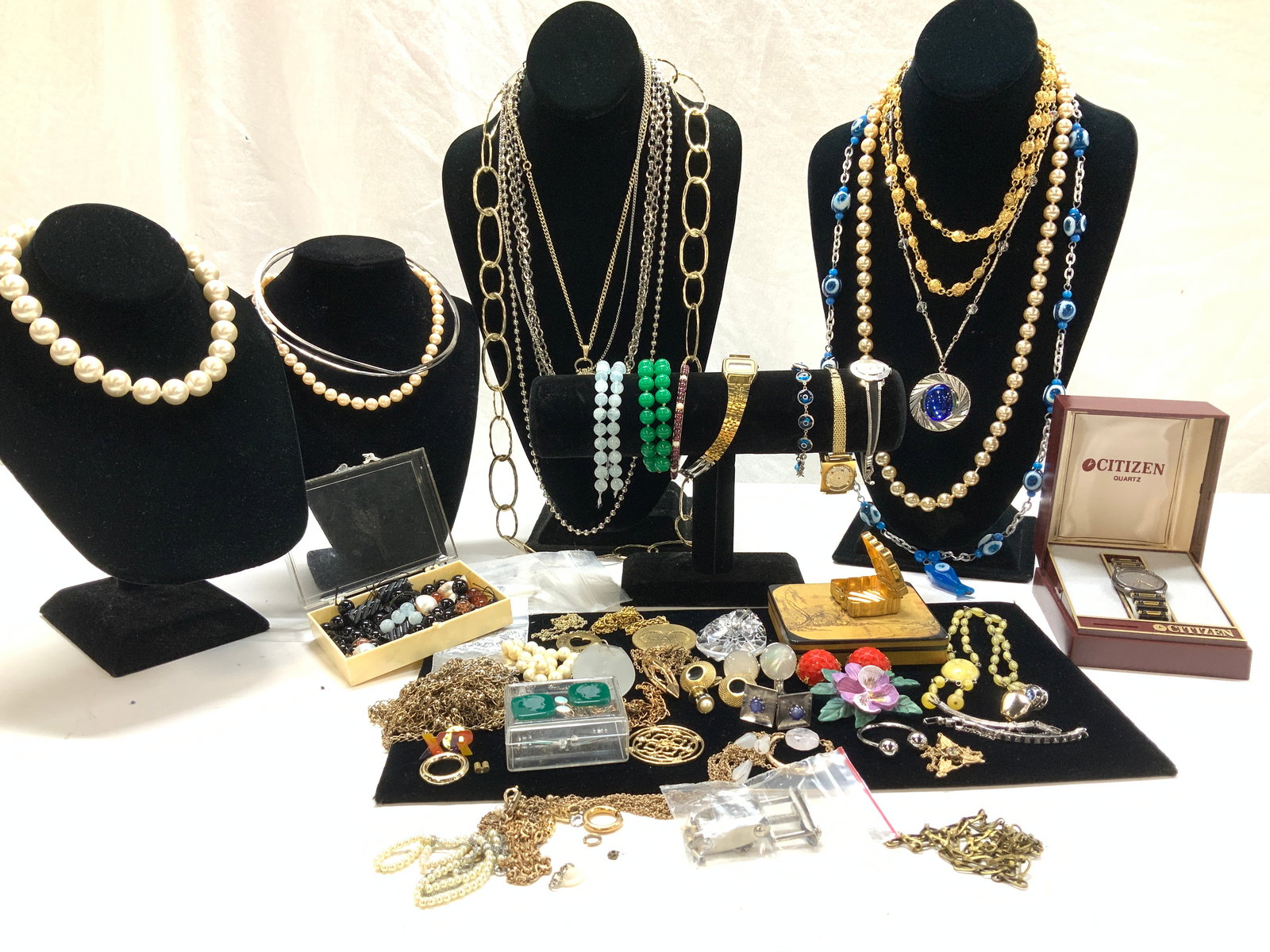 Lot of Costume Jewelry, Gems, MOP, Sterling: Variety of costume jewelry, sterling, and gemstone items. Mostly Necklaces. Some items are for jewelry making or arts and crafts. Highlights include chunky glass Pearl choker necklace, Monet Champaign