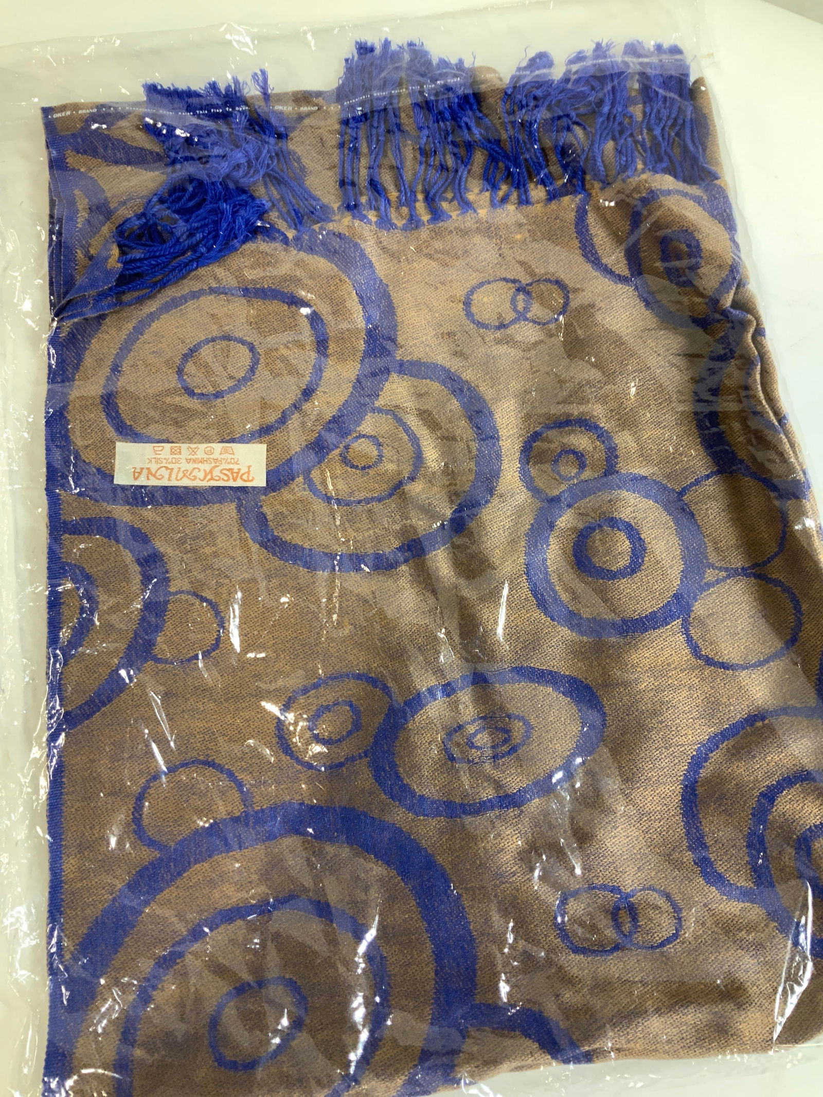 Pashmina Shawl, New in Package, Pashmina & Silk: Pashmina brand luxury shawl with tassels. Comes in the original package. 70% pashmina, 30% silk . Label affixed to garment. Bright cobalt blue on taupe. Opened package for photography. 27 x 78 in. Lad