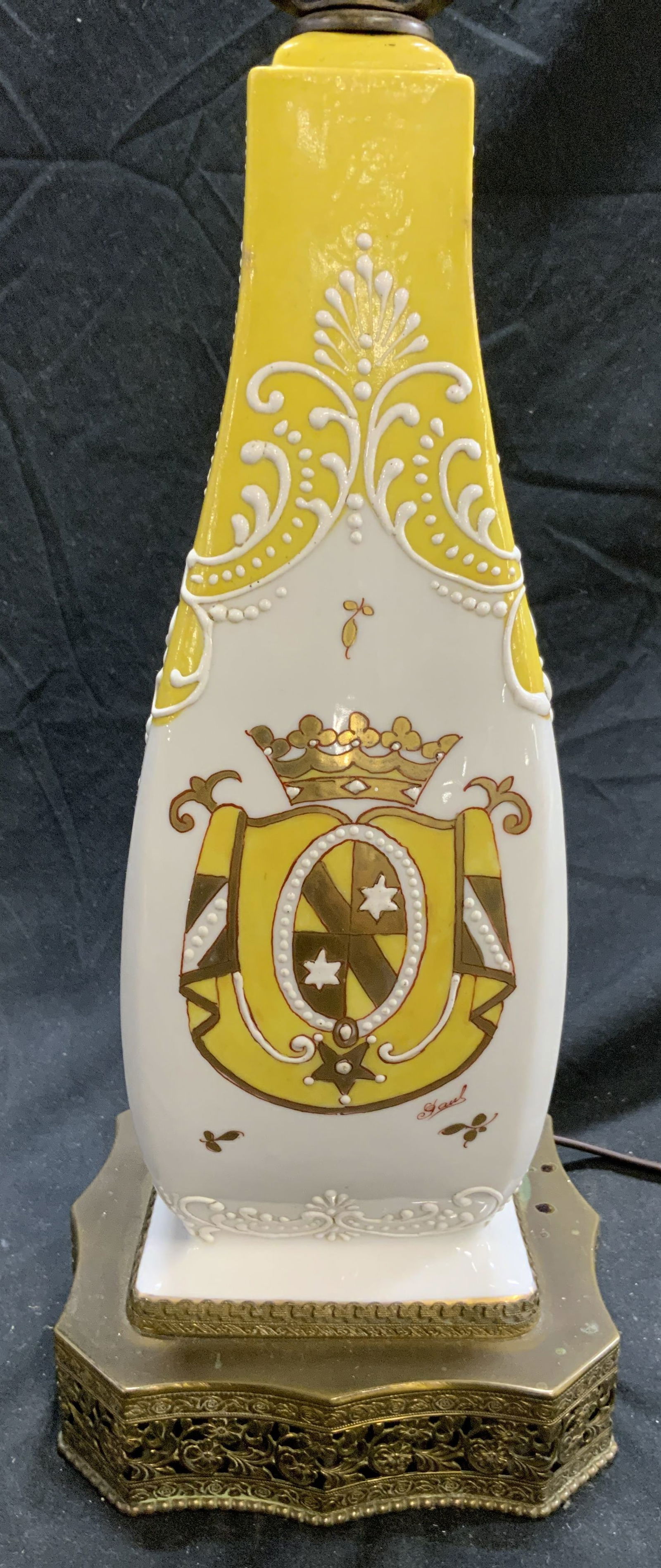 Vntg Hand Painted Porcelain Table Lamp FRANCE: Lamp is marked HAND PAINTED MADE IN FRANCE. Piece is porcelain with gilt metal base. Lamp has hand painted floral, & leaf detail. Lamp is vintage. Piece includes harp & finial. Lamp measures approxima