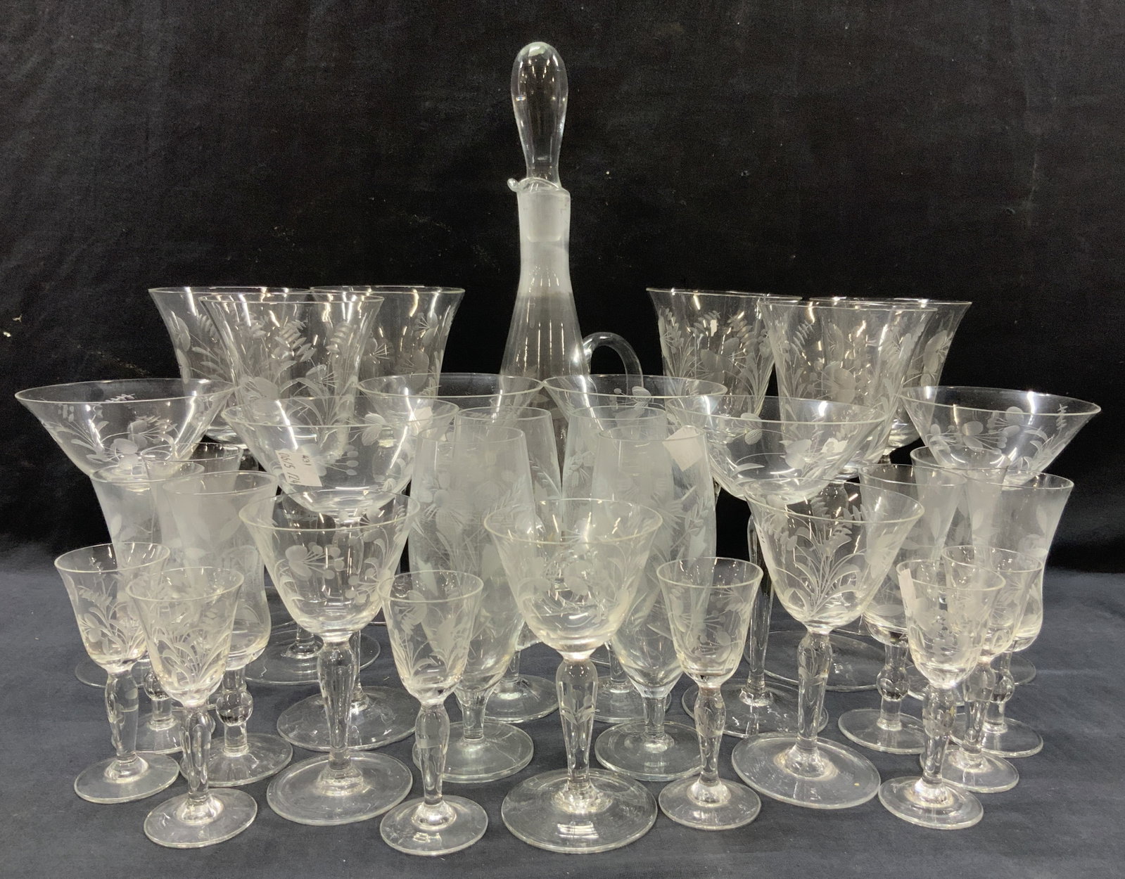 Set 32 Vntg Cut Glass Decanter & Stemware: Set 32 cut glass stemware and matching decanter at 14 inches tall with side handle. 6 wine glasses at 8 inches tall. 6 martini glasses, 4 footed glasses with side handles. 6 Sherry glasses at 5 inches