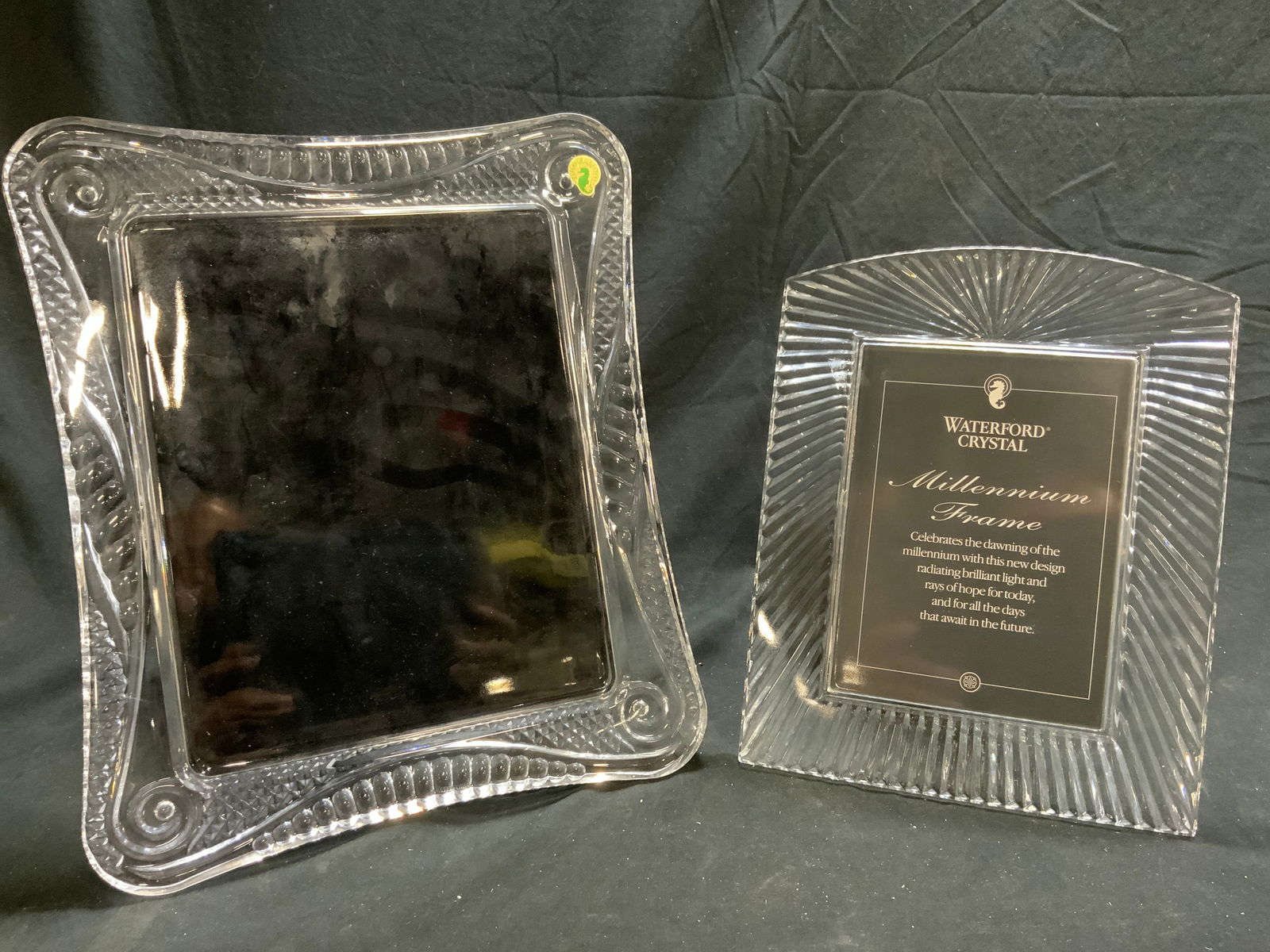 WATERFORD Crystal Millennium & Seahorse Frames: Each picture frame is trademarked WATERFORD. Each frame is crystal. One reads MILLENNIUM FRAME, the other reads SEAHORSE FRAME. Each picture frame has stand on backside. Largest frame measures approxi