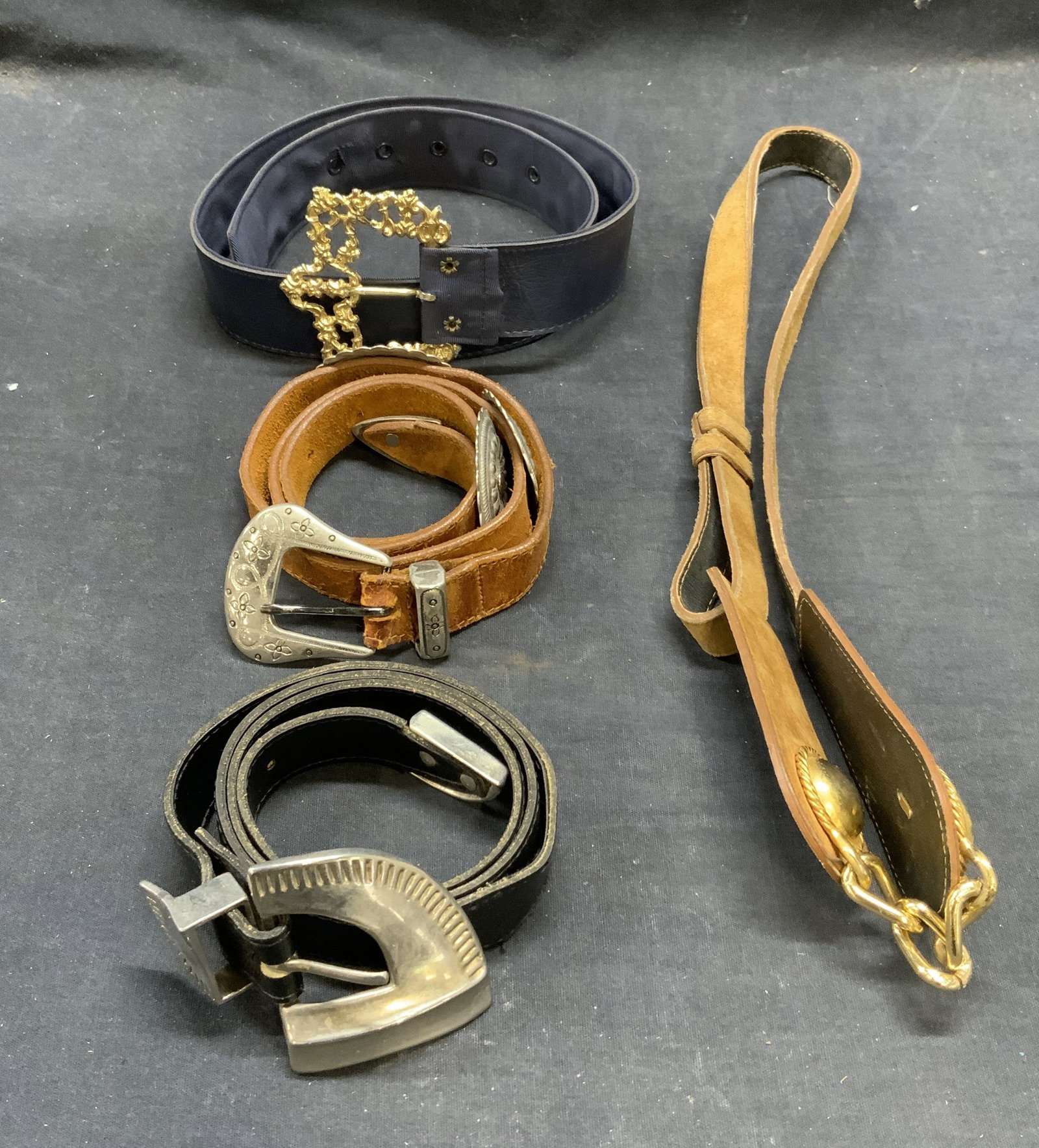 Lot 4 21st Century Woman Black Leather Belt, More: 21st Century Woman black leather belt with silver tone buckle. Measures approx. 35 inches long. Tan and brown leather belts. Blue belt with gold tone buckle. All pieces have wear to materials consiste