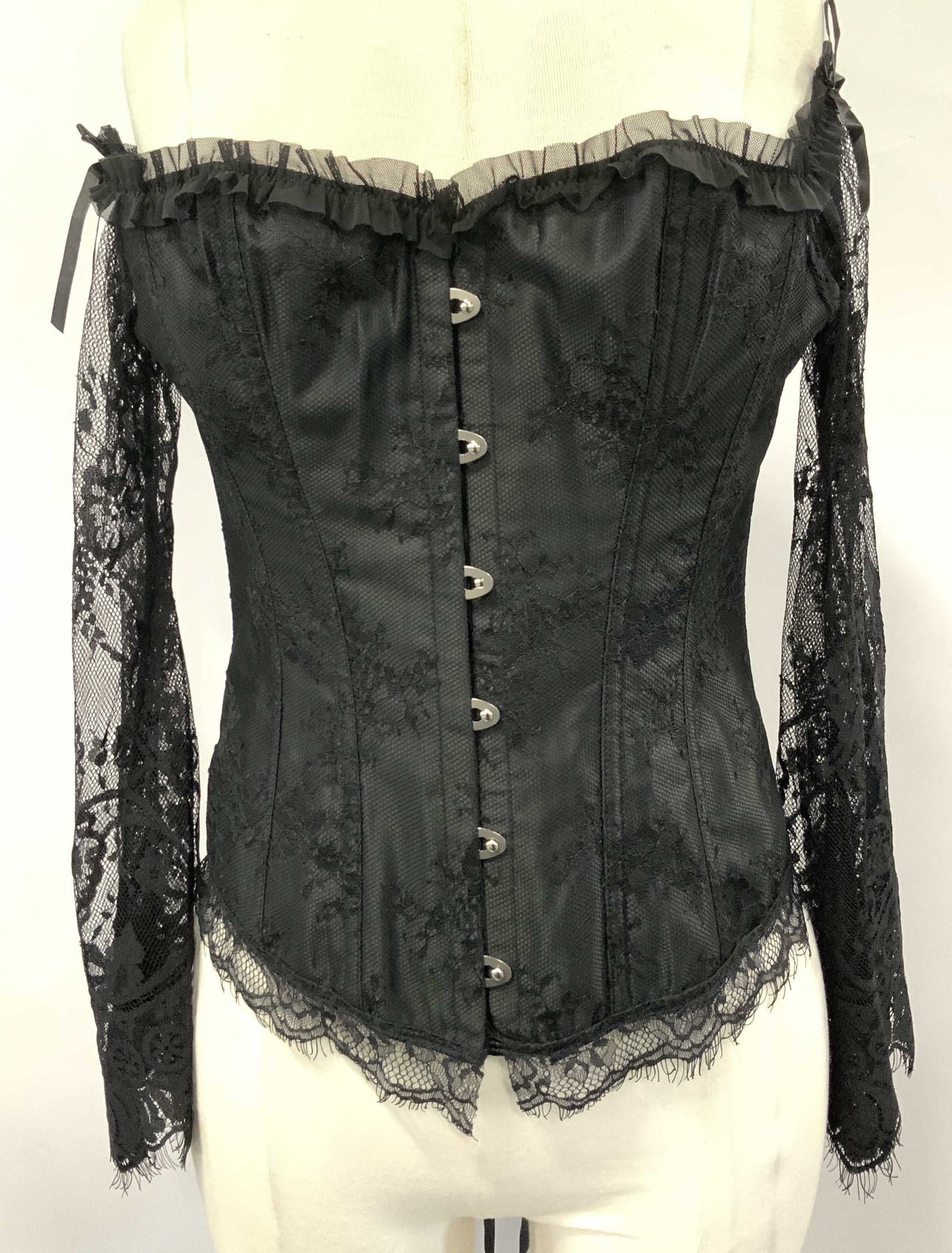Black Lace Corset Top with Lace Sleeves: Ladies corset top with lace sleeves in black. Label reads size large. Pleated bust line , metal loop and button closure with an extendable lace up back.,Nylon and spandex. Lining is polyester. Fits ov