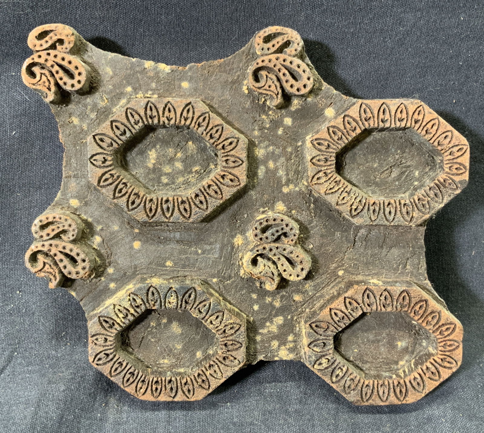 Vintage Wooden Hand-Carved Fabric Printing Block: Wooden hand carved block. Hand carved to be used as stamp. Meant for stamping fabric to create patterns. Block measures approx. 6 W x 5.5 H in. Verso reads 2 . Wire and nail on verso for hanging or st