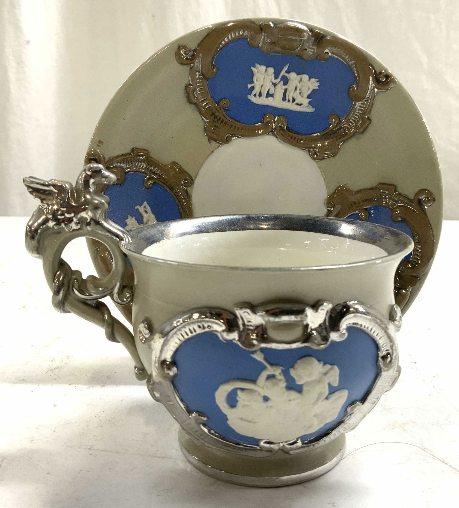 Wedgwood Style Embossed Stoneware Cup & Saucer Auction