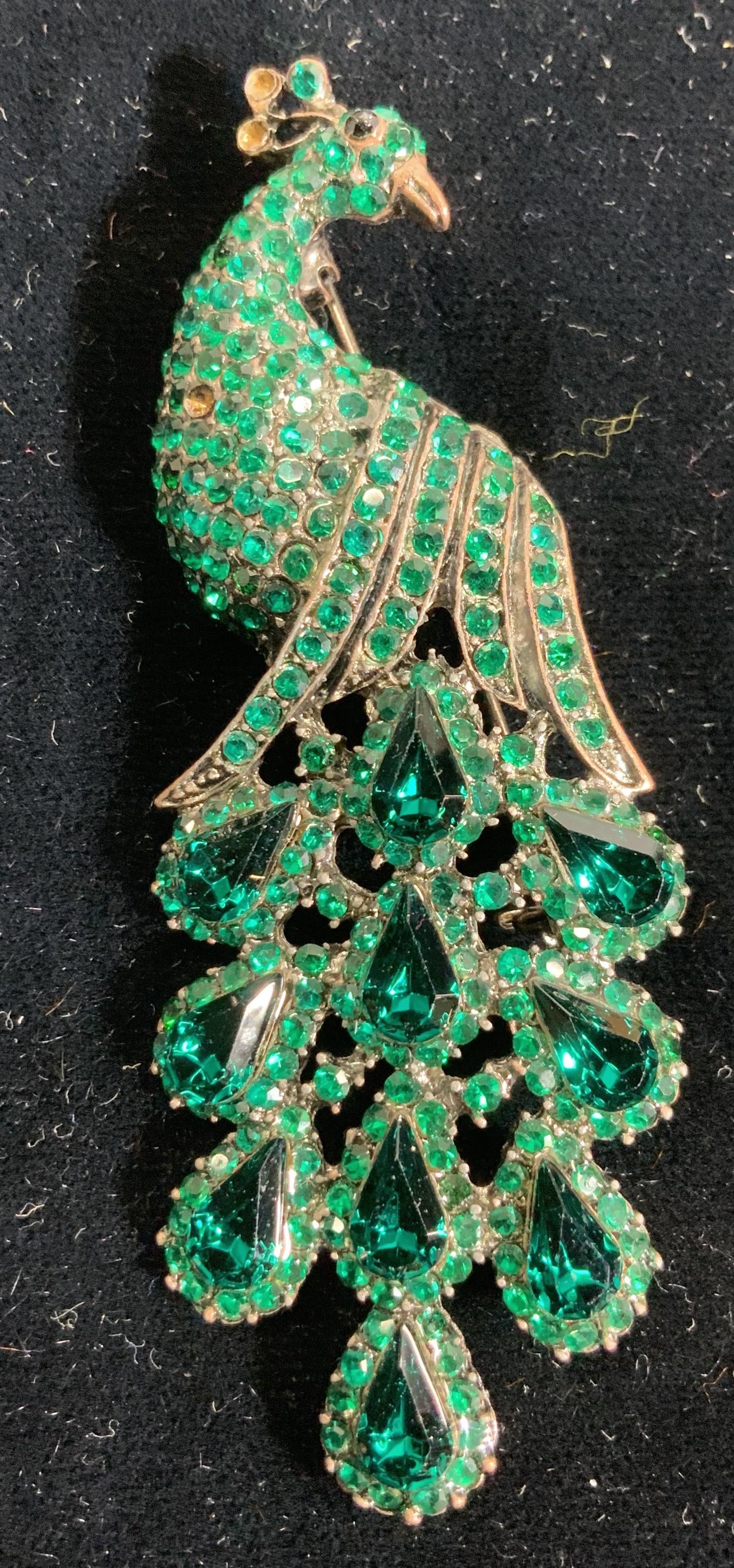 Emerald Crystal Peacock Cocktail Brooch: Emerald tone crystal brooch of a peacock. Measures 3 in. Long x 1.25 in. Wide. Lacks a few crystals. Wearables, Cocktail jewelry, fashion jewelry, Aurora Borealis jewelry, accessories, peacock brooch,