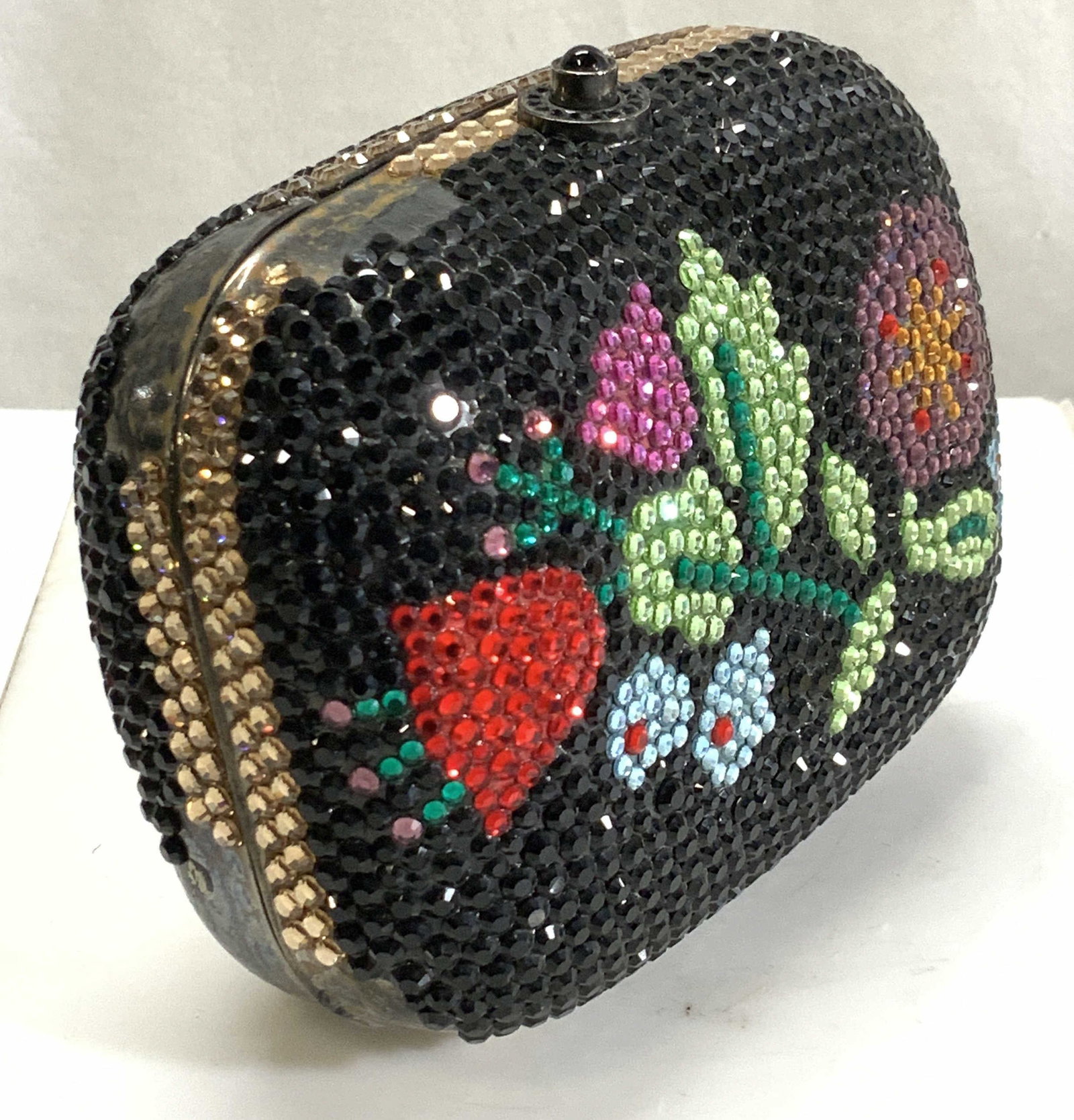 Y & S Original Rhinestone Evening Bag/Clutch: Hard case metal bag full of iridescent rhinestones with a flower decor. Bag measures 4.75 in. L x 2.25 in. W x 3.5 in. Ht. Some loss to rhinestones in a couple of sections. Strap can be tucked inside 