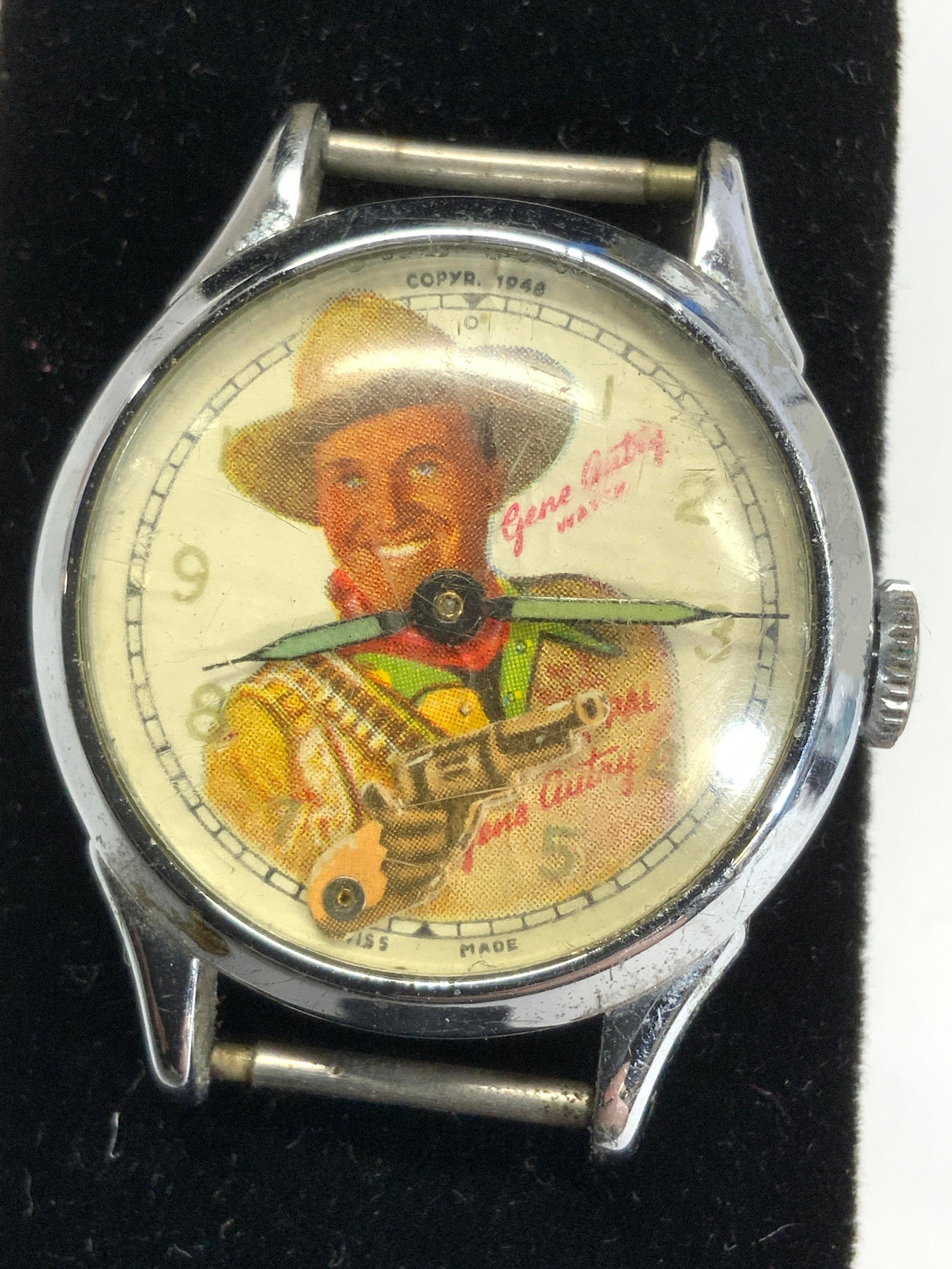 Gene Autry Western Cowboy Vntg Watch Case, 1948: Retro Gene Autry 1948 watch case. Autry as a cowboy. Swiss made., watch case measures 1.5 in. Long x 1.25 in. Wide., glass dome has scratches and case has rusting. Wind up watch. Watch case, vintage j