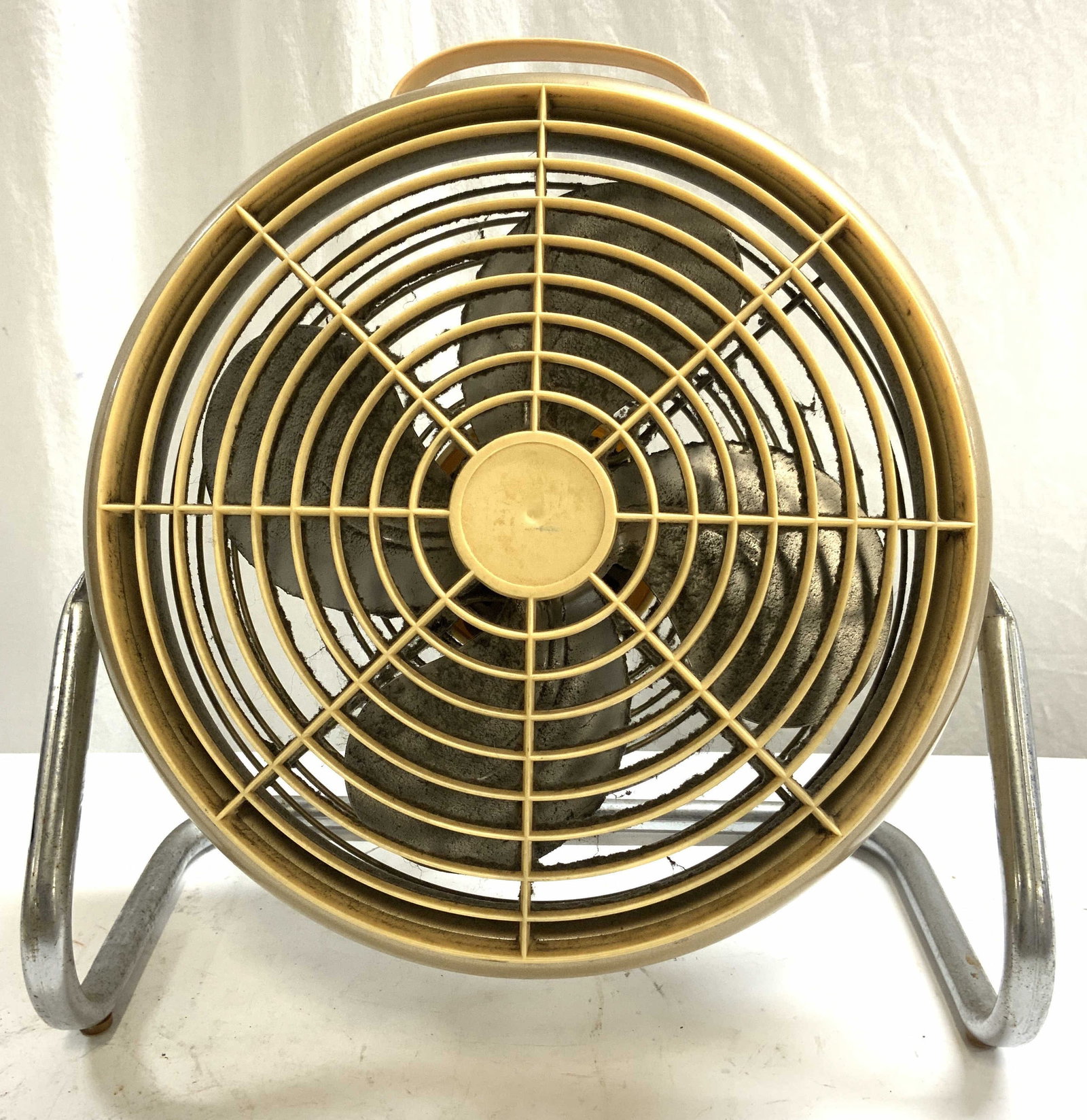 MCM Vintage Ambassador Fan: Fan appears to be AMBASSADOR (no apparent markings). Fan is cream and tan toned. Piece has silver toned metal stand. Fan appears to have metal blades. Top of piece has handle. Fan measures approximate