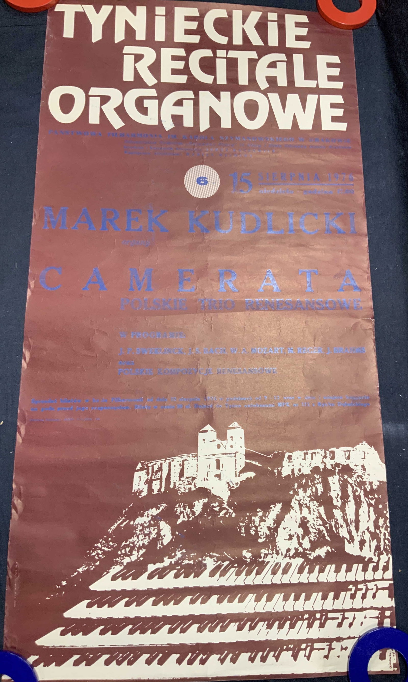 1976 King Size Polish Organ Recital Poster: Paper poster. Polish poster advertising an organ concert. All text on poster in Polish. Art on bottom done by Corowski 1976. Poster measures approx. 38 H x 19 W in. Wear to edges, warped to roll. Post