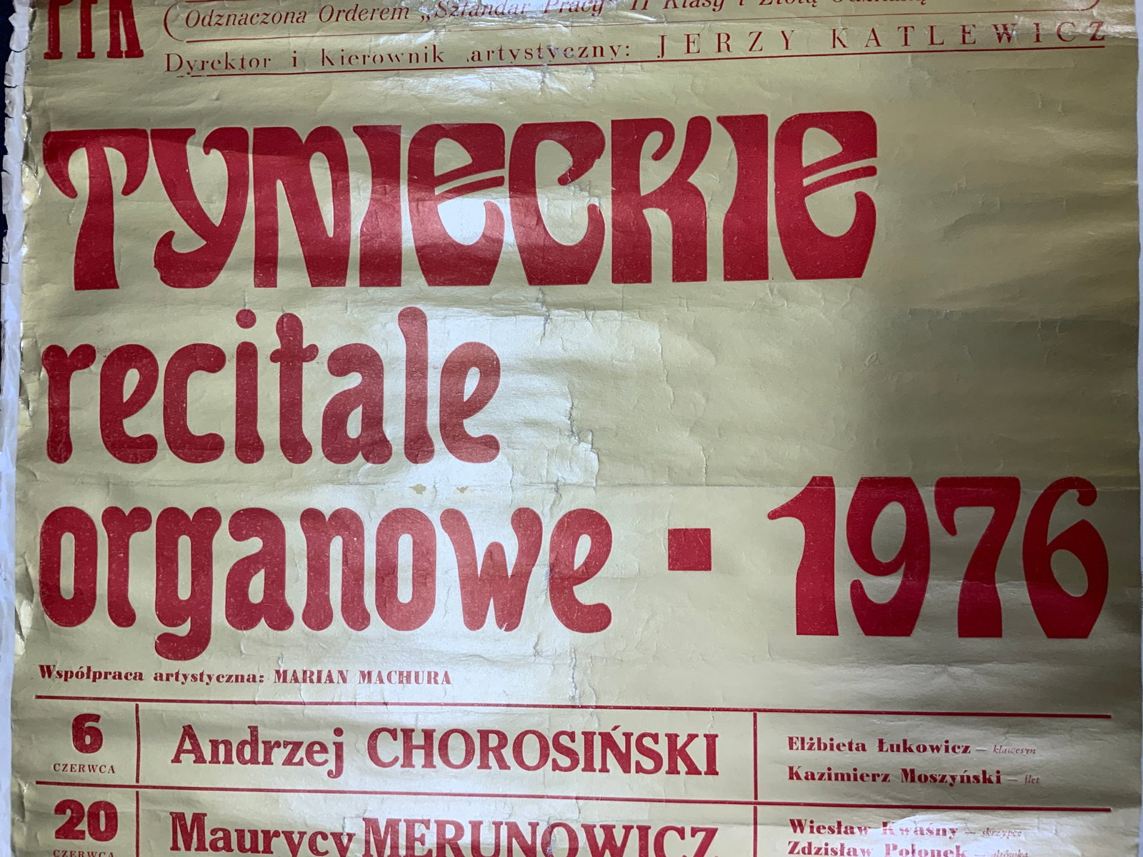 1970s Gilt Polish Concert Poster with Dates: Gilt poster on paper. Polish Concert with Directors name and dates with lead artists. All text on poster in Polish. Poster measures approx. 27 H x 19.5 W in. Edges have wear and tears. Warped to roll.