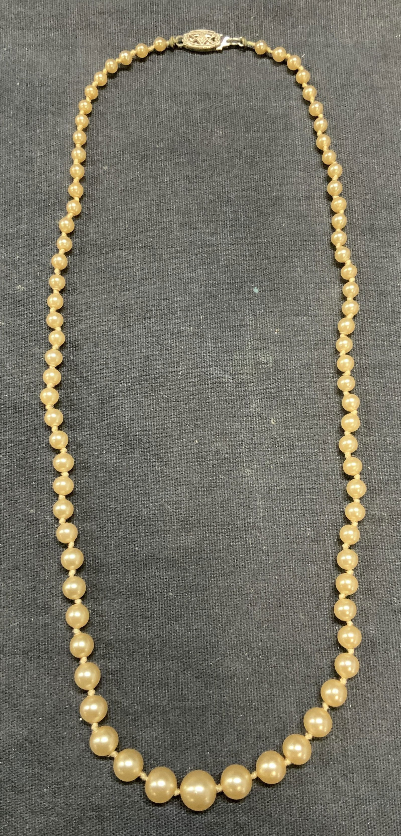 Vintage Faux Pearl Beaded Necklace: Vintage faux Pearl beaded necklace on double knotted string. Drop length approx. 8.5 inches. Some surface wear including scratching observed. Estate jewelry, costume jewelry, cocktail jewelry, fashion