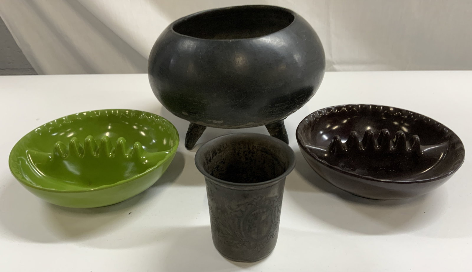 Lot 4 Sterling Silv Vessel, Ash Trays, & Ceramic: Lot includes 1 sterling silver vessel (weight 1.47 OZT) with etched detail inscribed 800 on underside, 2 ash trays trademarked ANHOLT ASHTRAY, & 1 ceramic vessel with 3 feet. Ceramic vessel measures a