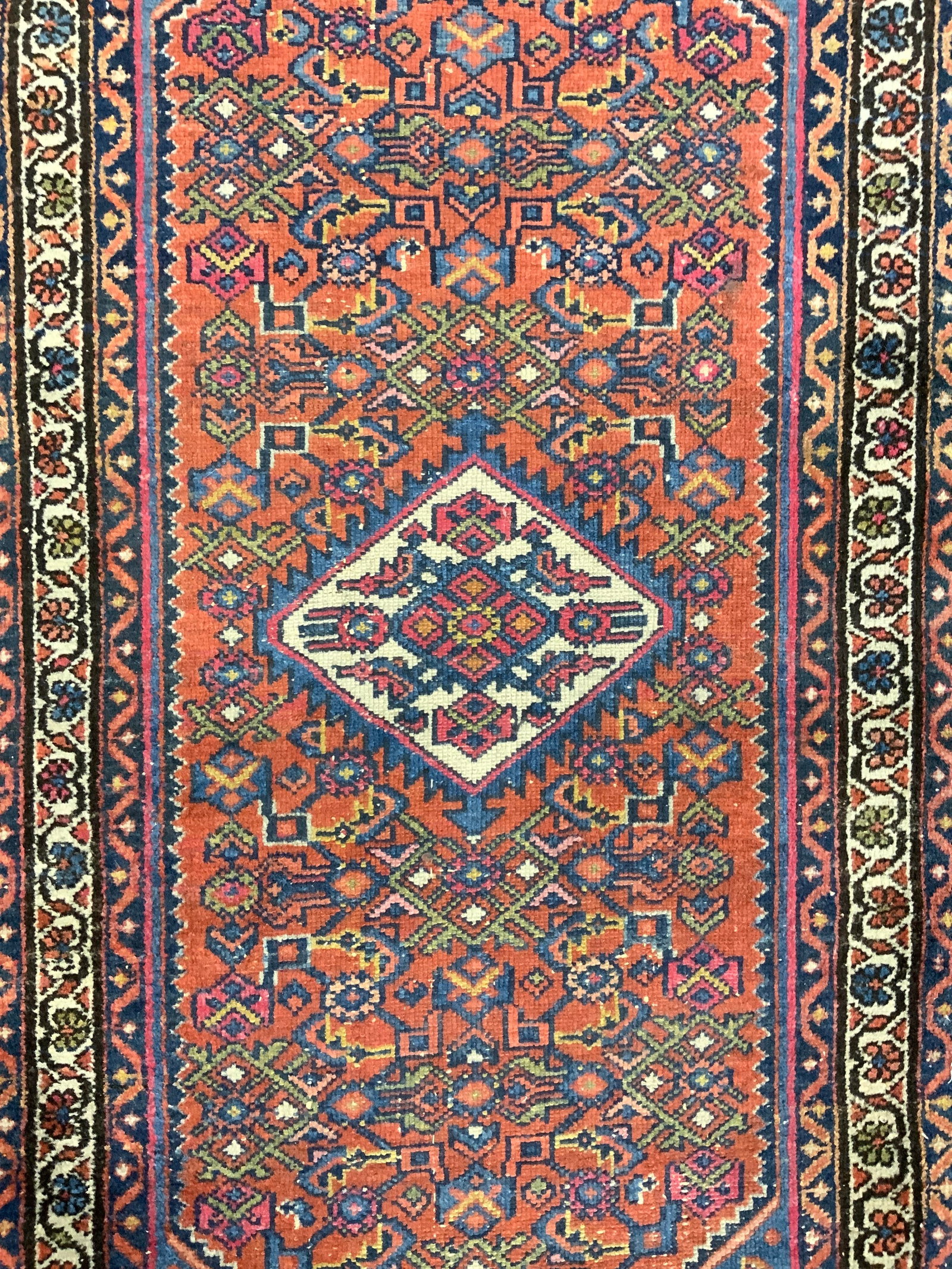 Vintage Handmade Persian Wool Area Rug: Rug is handmade and wool. Piece has intricate multi toned floral motif & geometric derail. Rug is vintage. Piece measures approximately 49 inches long 29 inches wide Rug, carpet, wool rug, Persian rug