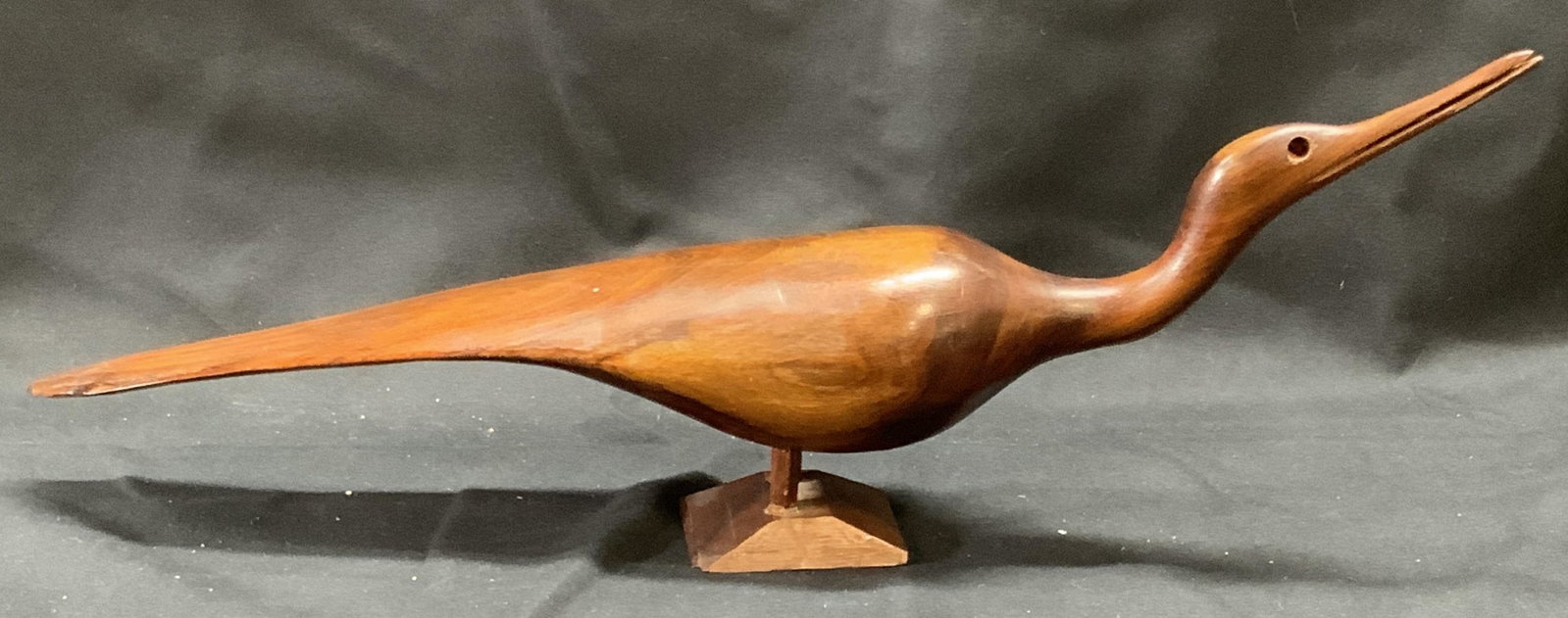 Carved Wood Bird Figural: Carved wood bird motif figural. Measures approx. 13.5 x 4.5 inches. Some surface wear including scratching and small chips observed. Bird, bird figural, carved wood, decorative arts, home decor, home 