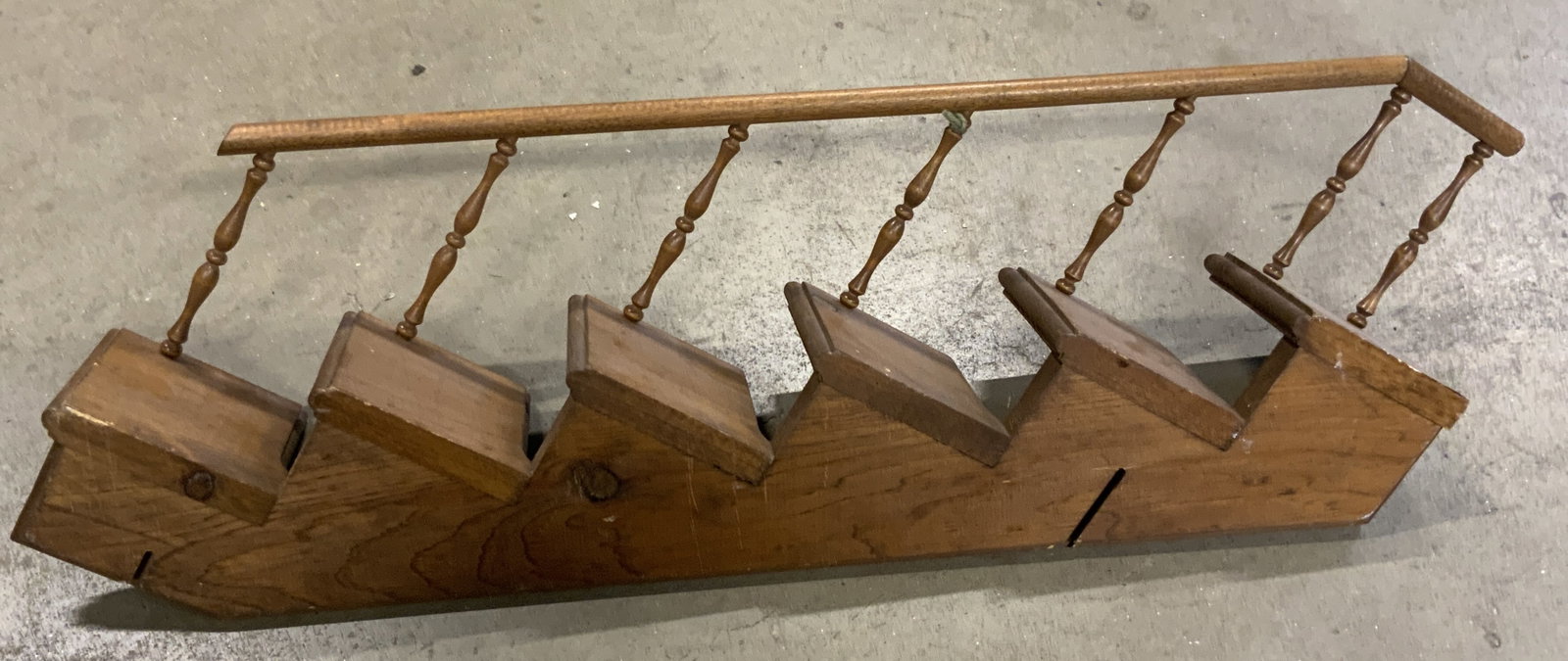 Vintage Wooden Stair Motif Display Shelf: A vintage wooden stair motif display shelf. Measures approx. 6H x 31W in. Some surface wear consistent with age, use, and exposure. Chipping and discoloration present. Collectibles, woodwork, wood she