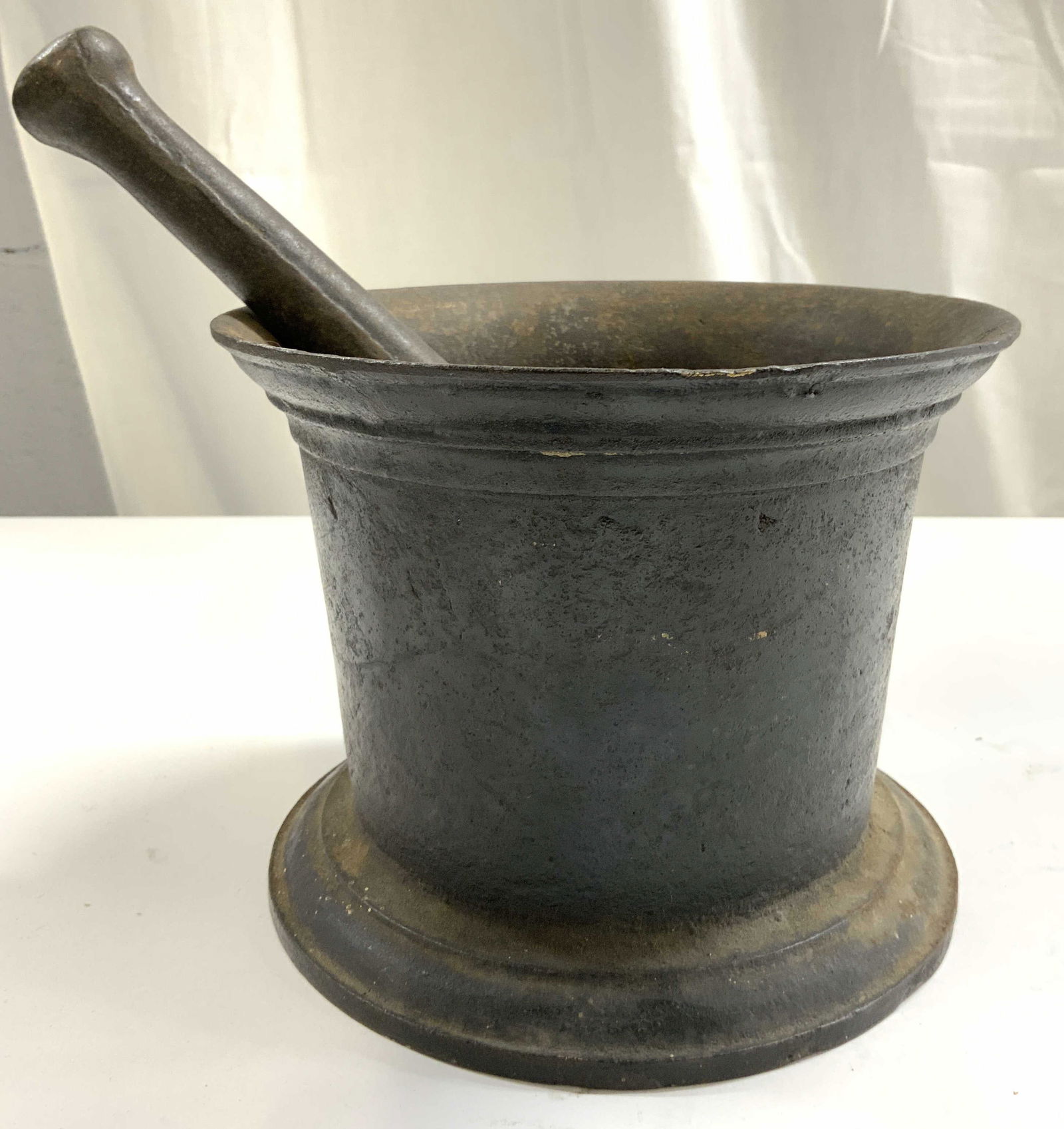 Antique Iron Mortar & Pestle: Lot includes 1 mortar & 1 pestle. Each piece appears to be iron. Set is heavily weighted. Each piece is black toned mortar measures approximately 6 inches tall 8 inches wide. Mortar and pestle, antiqu