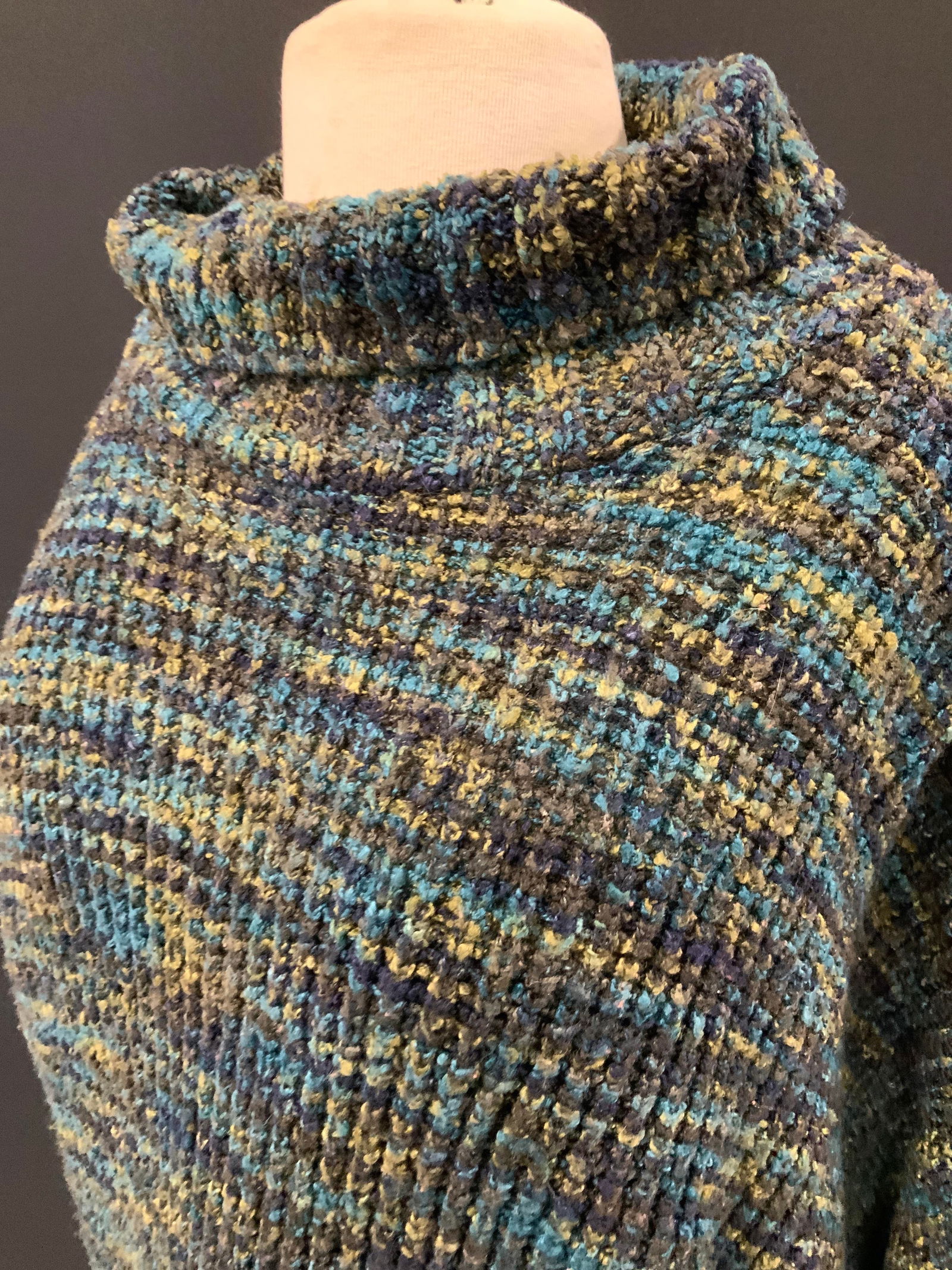 525 Teal Sweater, USA: Ribbed acrylic ( possibly) sweater with teal and green color palette. Labeled Size Medium/ large. Should also fit Size XL. Designer 525. 26.5 in. Long x 48 in. Waist. Winter sweater, wearables, knitwe