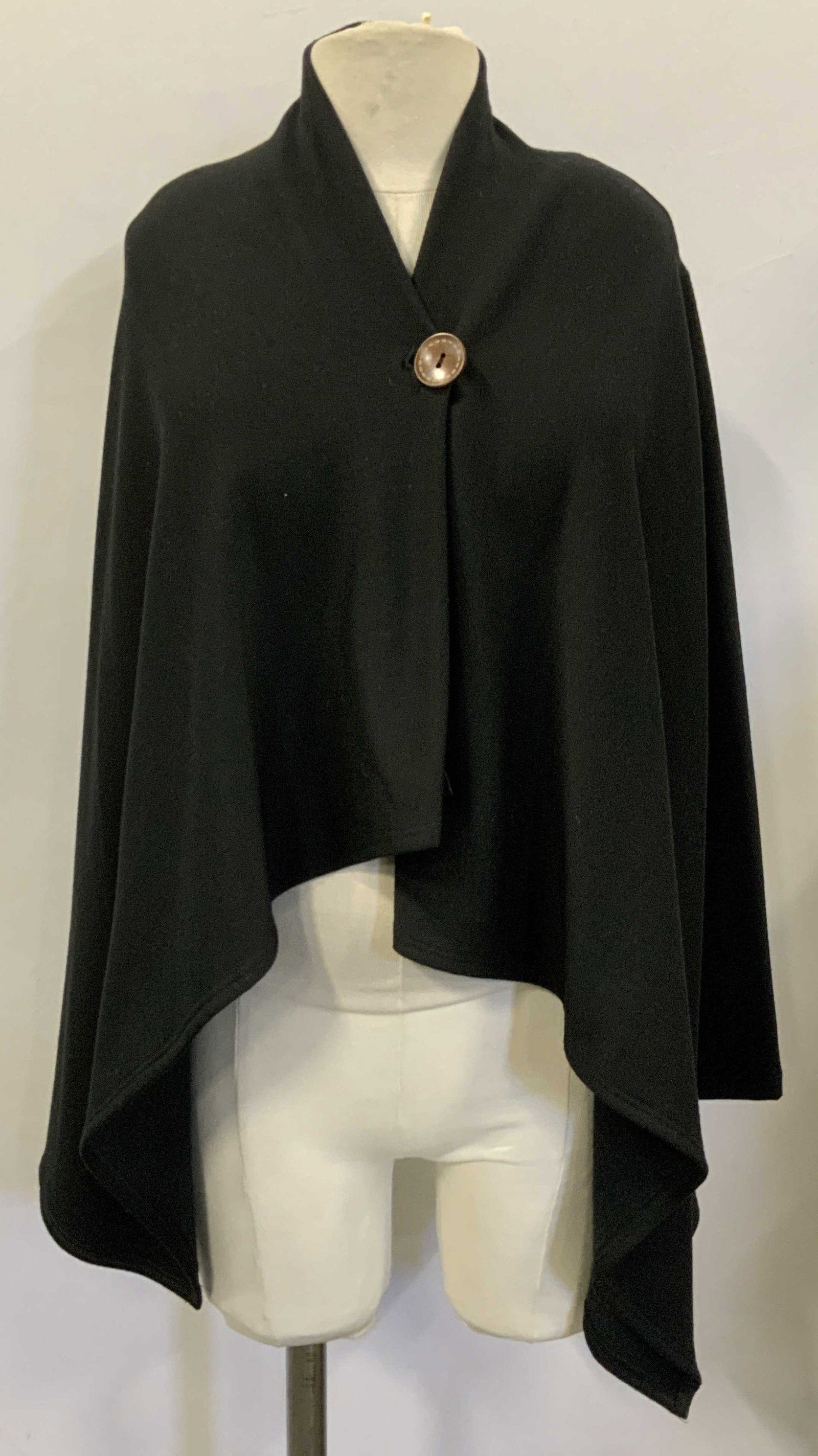 Bobeau Black Soft Jersey Long Sleeve Jacket: Designer Bobeau black polyester and rayon knit jacket with spandex. Very soft hand. Long sleeves. There is a singular wood button. Drapes as it it were a cape. Size XS. gently used. Knit jacket, up sc