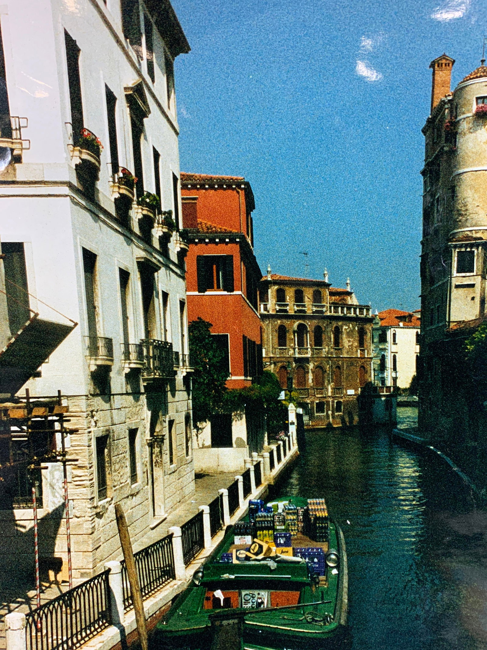 Venetian Italy Large Photograph with Matte: Photograph on paper. Subject depicts a gondola in the canals of Venice, Italy filled with soda. Photograph affixed between two large mattes. Matte measures approx. 28 H x 31.5 H in. Window measures ap