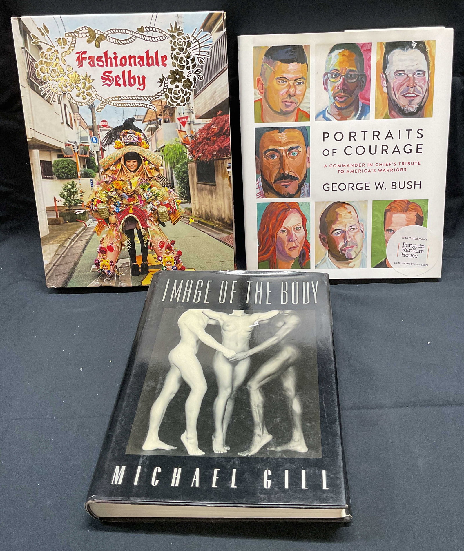 Lot 3 Fashion & Art Books1989-2017: Lot of 3 fashion and art books. Includes Fashionably Shelby, Abrams, 2014, Portraits of Courage by George W Bush, Crown Publishers, 2017, and Image of the Body by Michael Gill, Doubleday, 1989. All bo