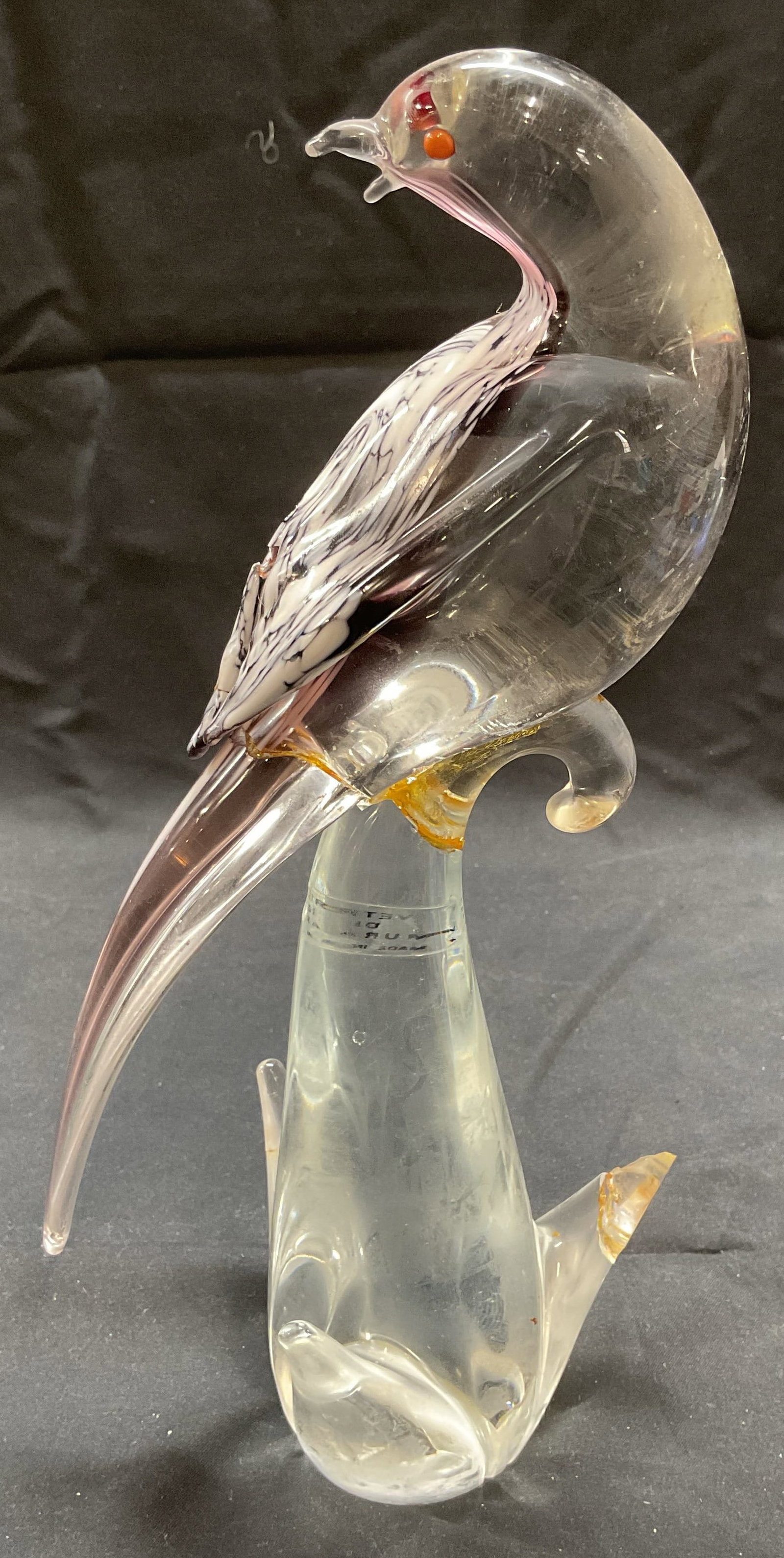 MURANO Art Glass Bird Figural, Italy: MURANO Art glass bird figural. Clear, purple, and white toned glass. Piece has weight. Signed in sticker. Made in Italy. Measures approx. 5 x 10.5 inches. Surface wear including chips, scratching, and