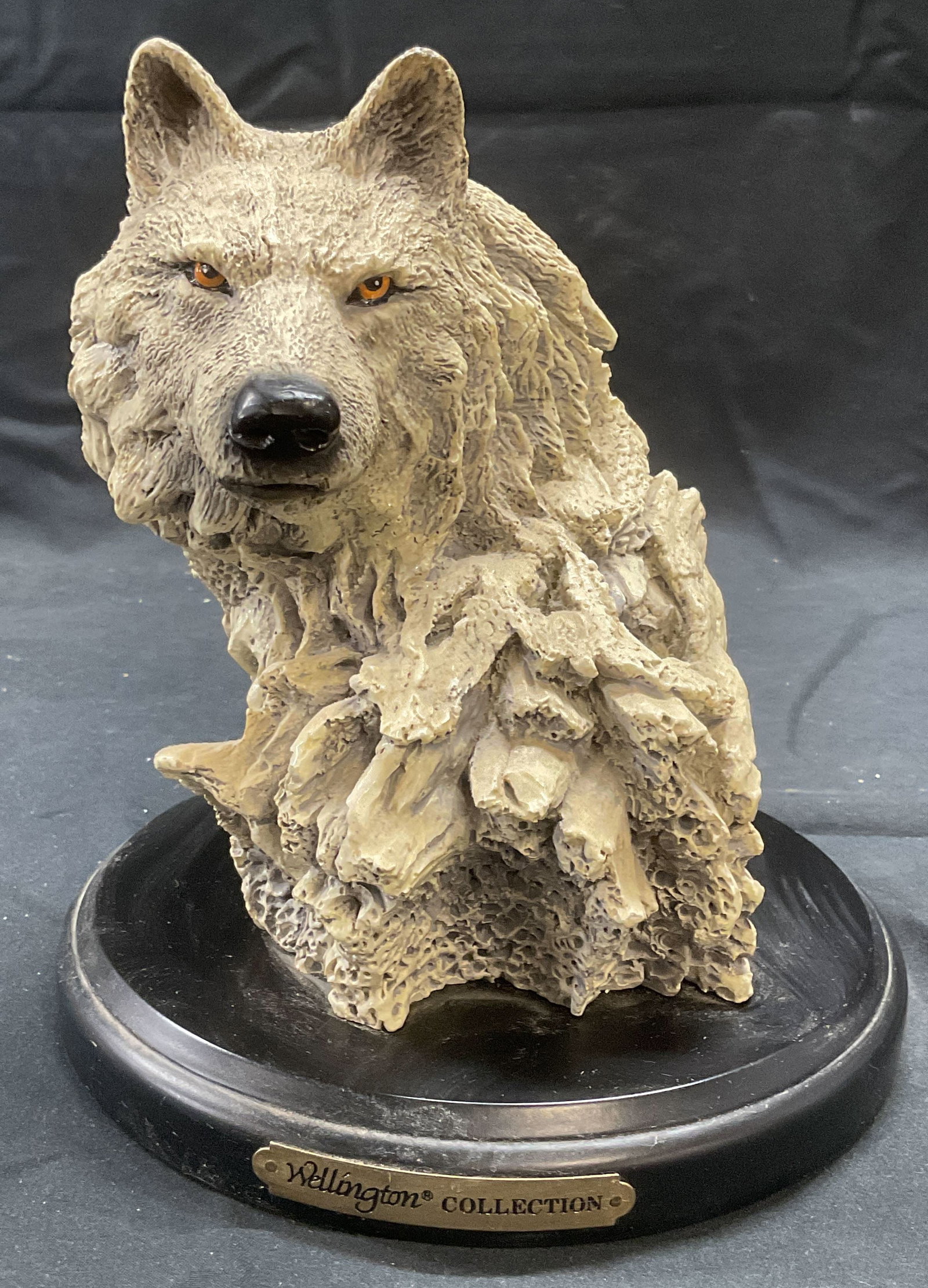 Wellington Collection Wolf Figural: Wellington Collection wolf figural. Composite material. Signed on base. Measures approx. 7 x 7.75 inches. Some surface wear consistent with exposure. Wellington collection, wellington collection wolf.
