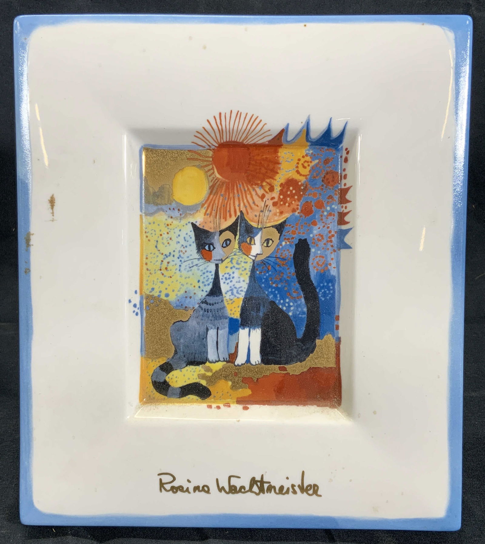 Goebel Rosina Wachtmeister Picture Plaque Cats: Ceramic picture plaque with backing foot. Lithograph on ceramic. Titled Romantico. Signed in print in gilt on bottom. Subject depicts an abstract patterned background with two cubism style cats. Ceram