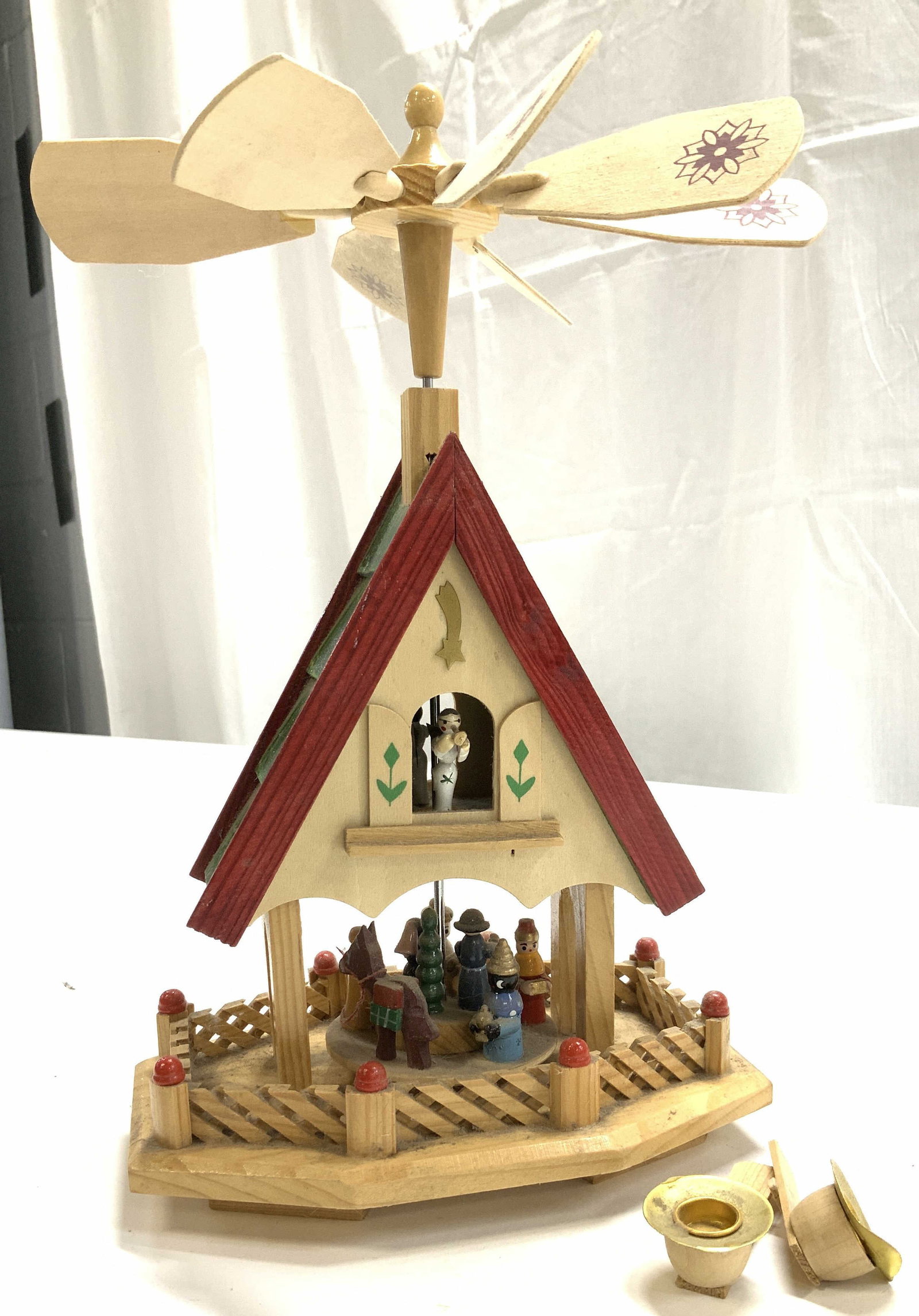 Hand crafted Alpine Wooden Candle Windmill: Holiday tabletop wooden windmill powered by candle. Christmas Arts and crafts, handmade. Candle holders are loose and lacks couple. Lacks 2 wooden windmill blades. Measures 12 in. Ht x 7.5 in. W x 5 i