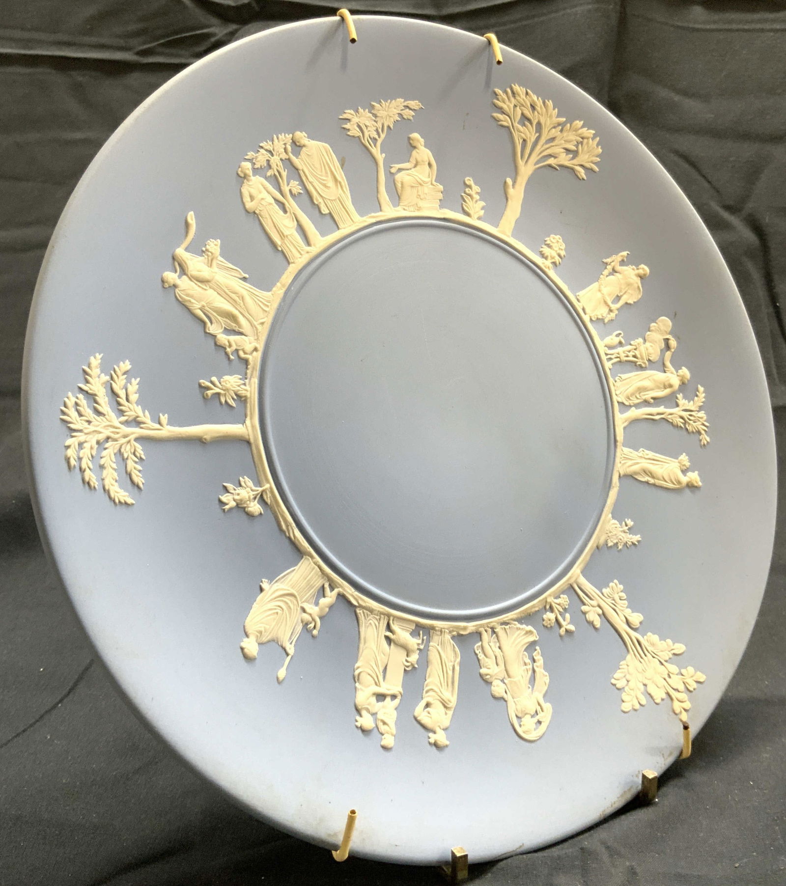 WEDGWOOD ENGLAND Light Blue Jasperware Plate: Underside is inscribed WEDGWOOD MADE IN ENGLAND. Plate is light blue with white toned figural, tree, floral and leaf detail. Plate measures approximately 9.5 inches diameter. Plate, Wedgwood, vintage